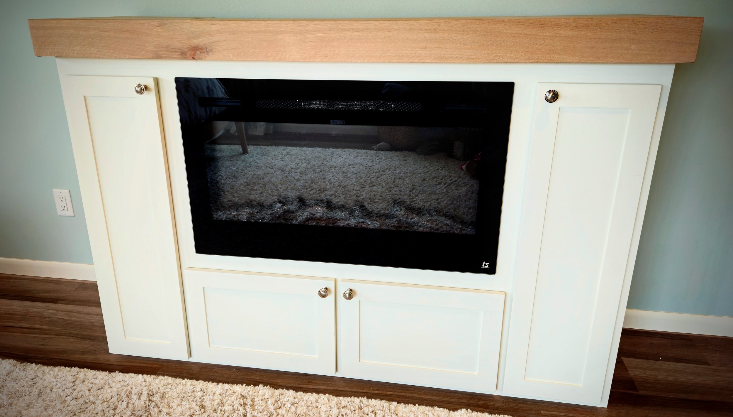 Fireplace and hidden TV cabinet