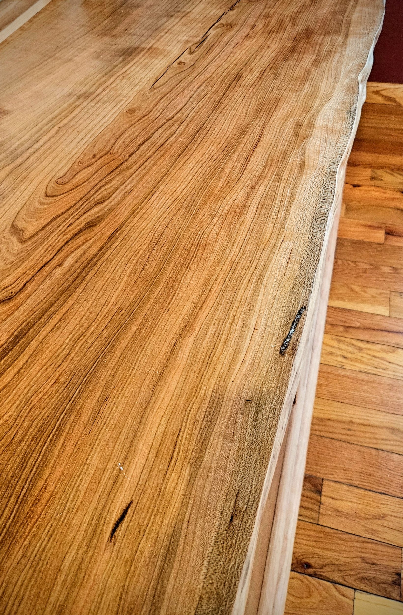 Live edge cherry top on entertainment cabinet 