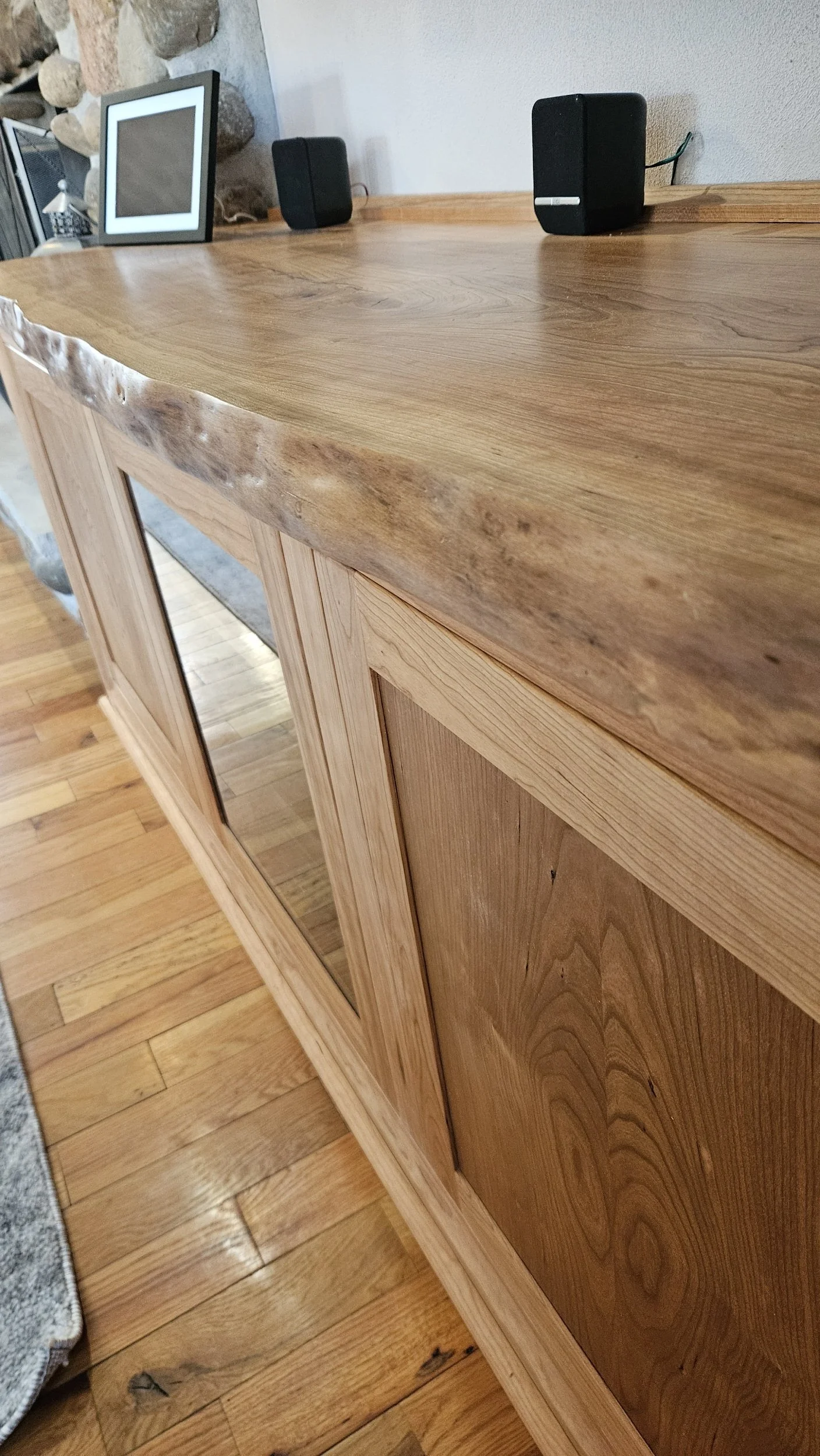 Live edge on cherry entertainment cabinet