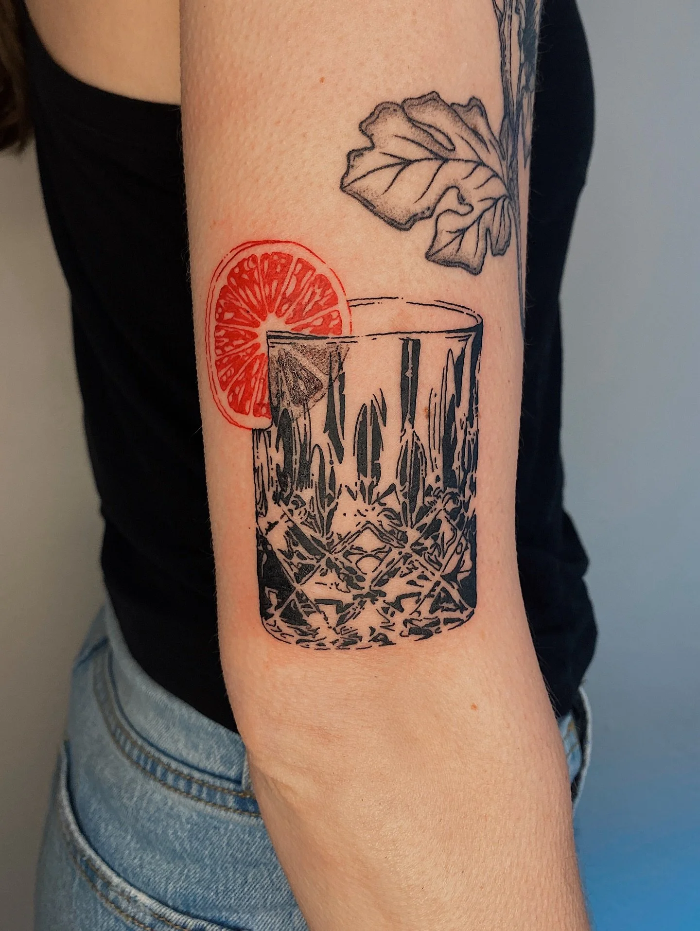 Rocks glass with an orange slice for Erin 🍊