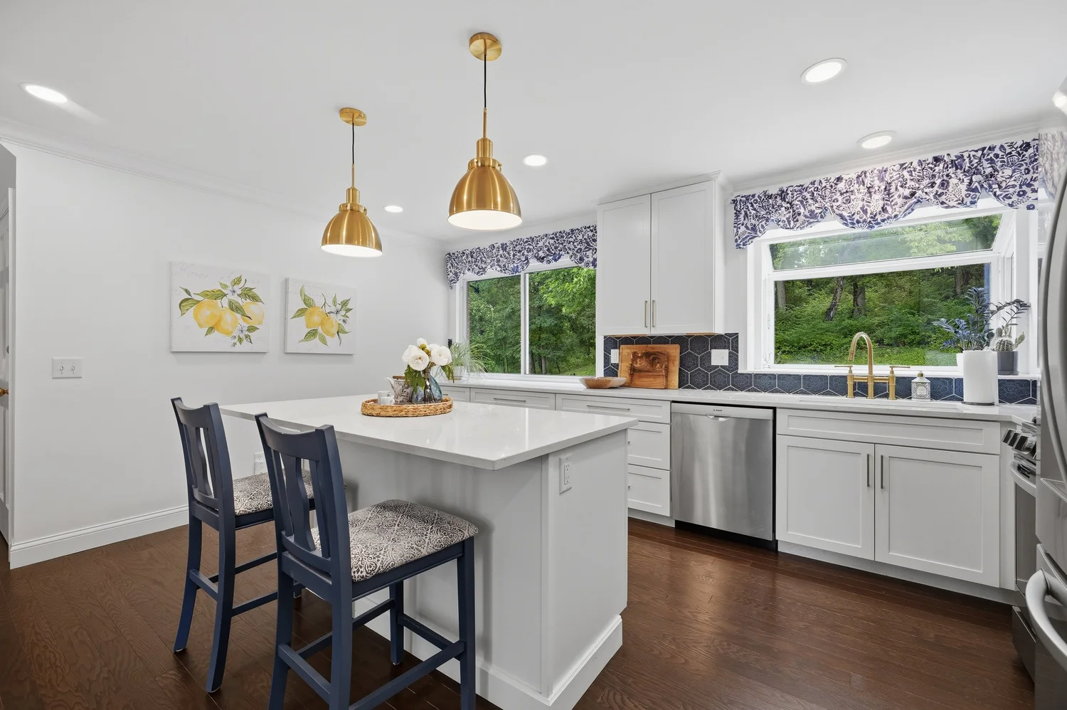 Kitchen island with brass pendant lights
