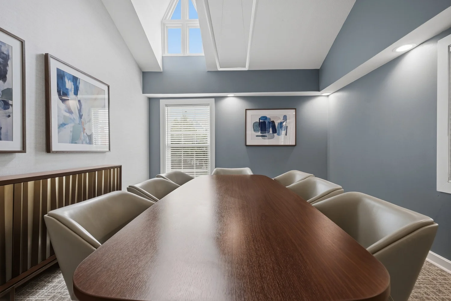 Conference room with leather chairs and blue walls