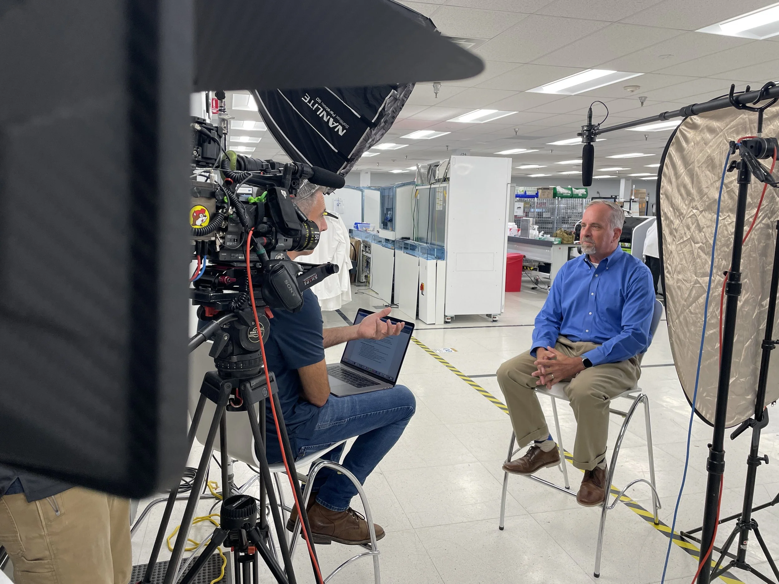 Interview lighting setup on a manufacturing floor