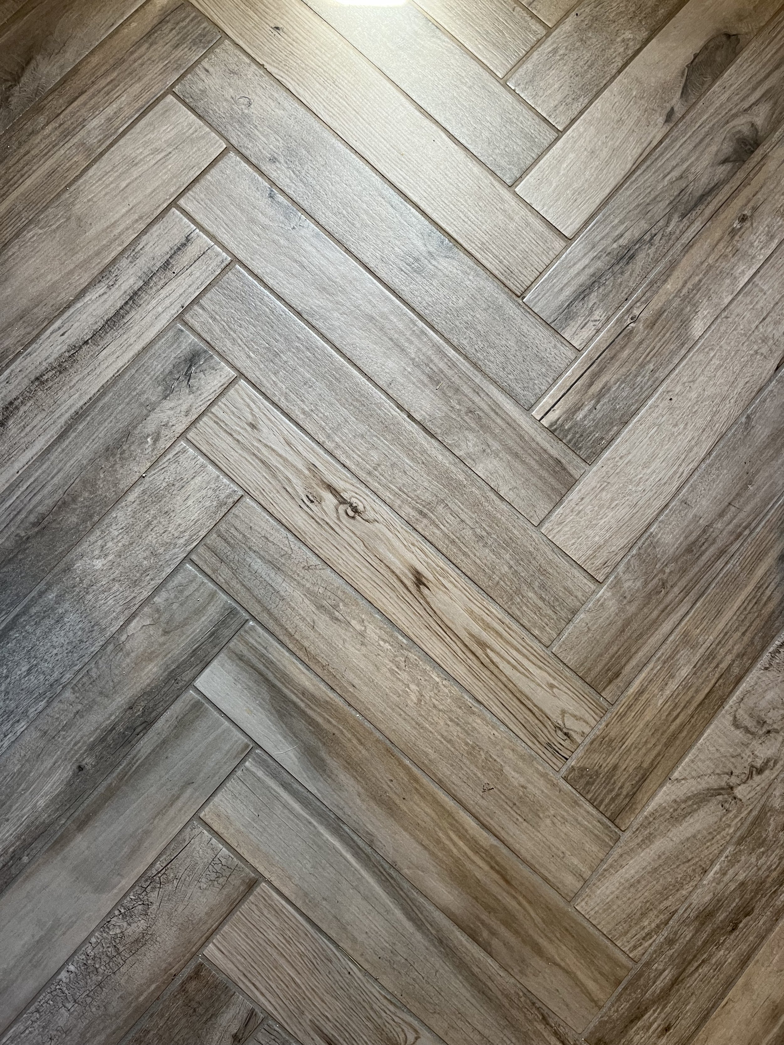 Herringbone pattern in laundry room.