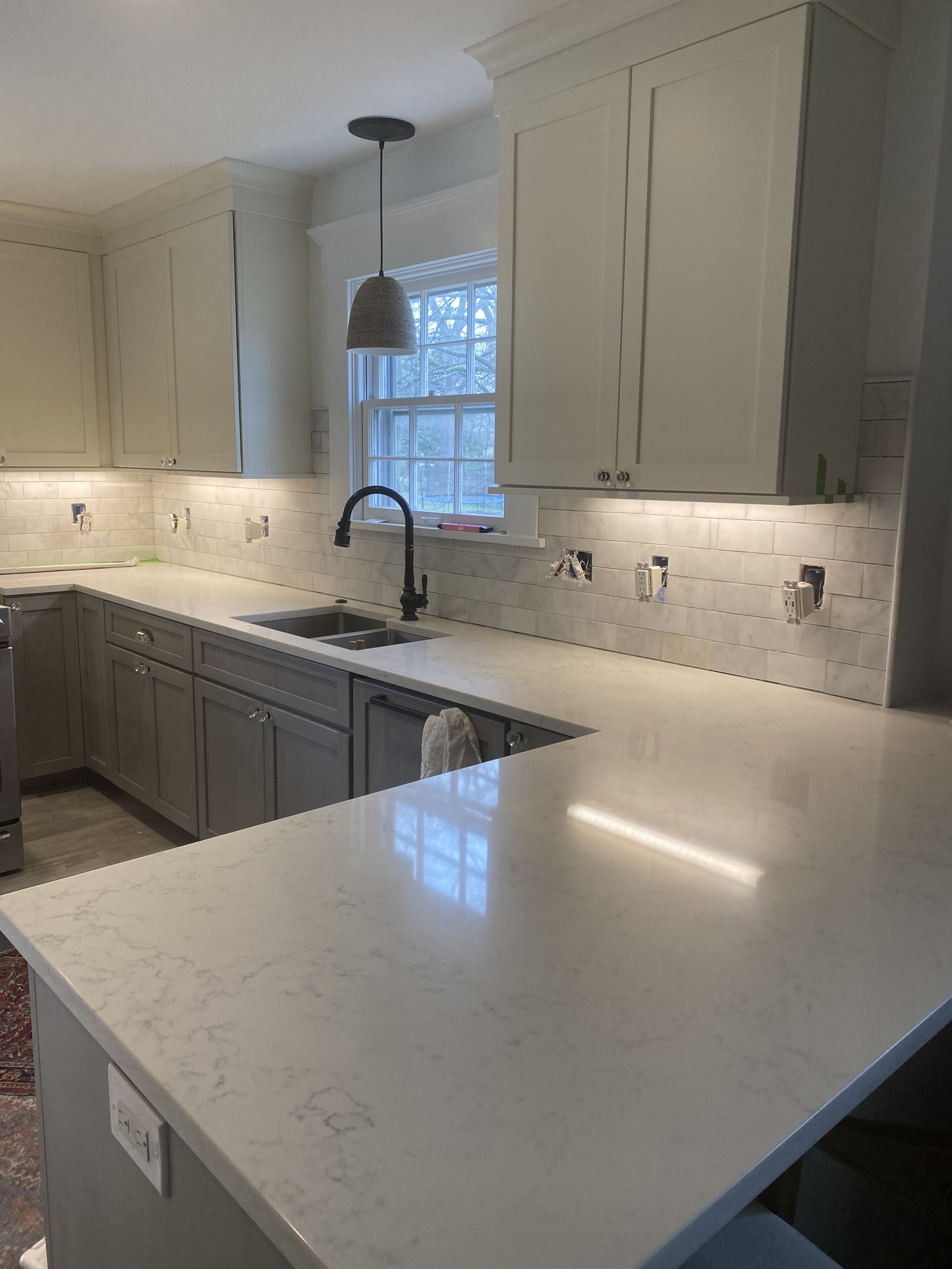 Updated natural marble backsplash.