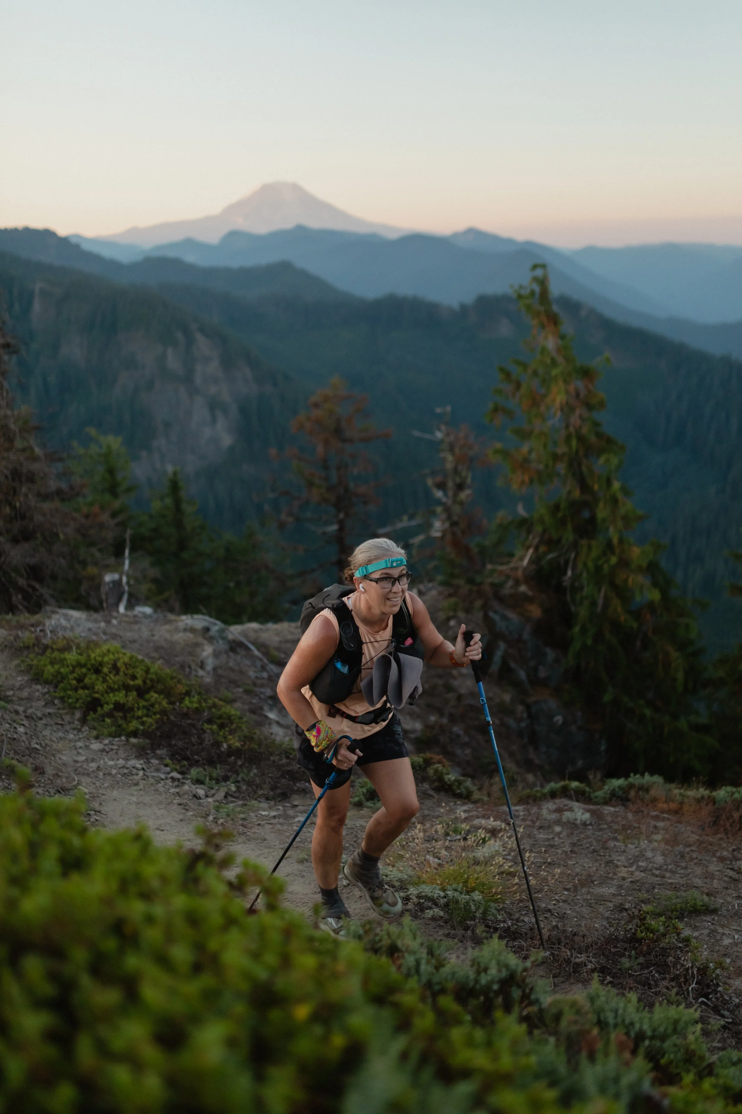 Woman trail running in mountains