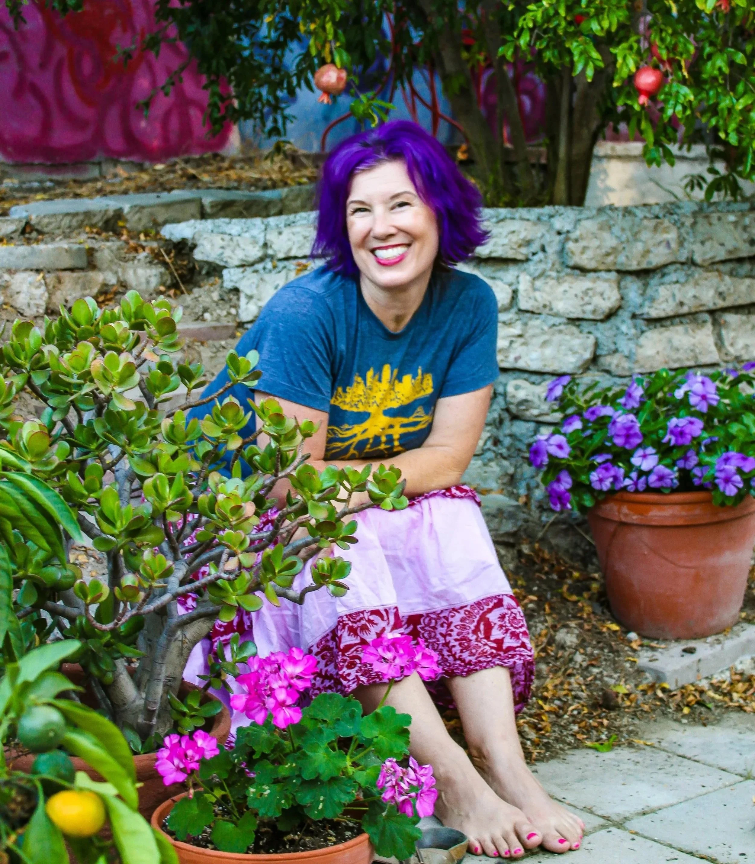 Grief therapist Jenny Leverman in her colorful garden