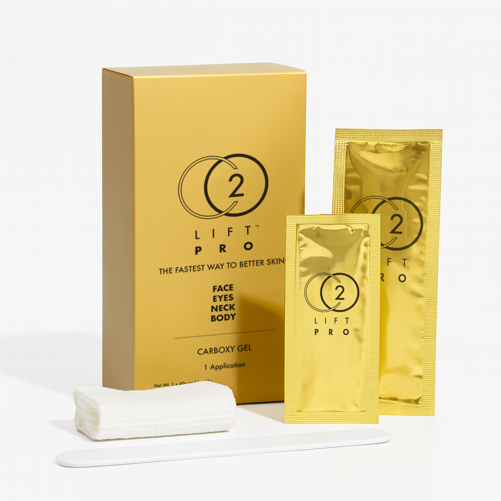Gold box of 2 Lift Pro carboxy gel with two gold sachets, a rolled white cloth, and a white applicator on a white background.