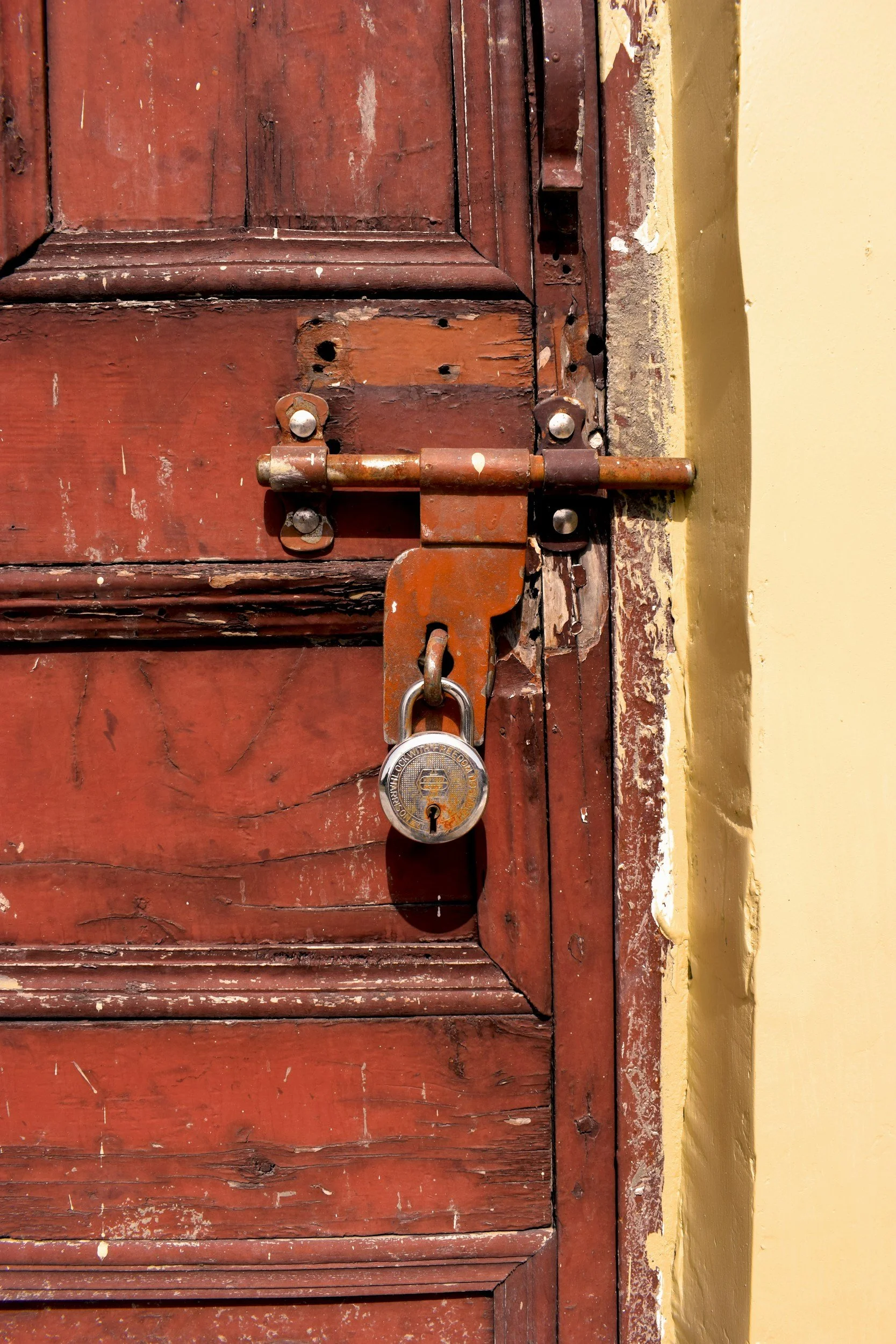Person checking a door lock representing physical compulsions in OCD