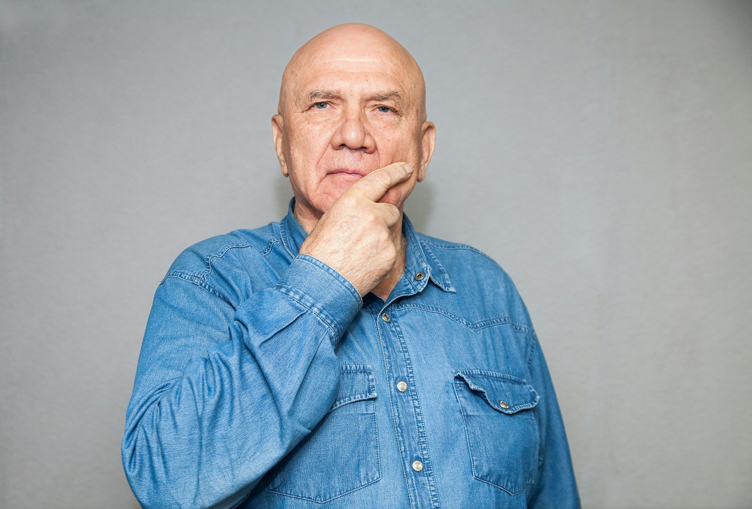 man with hand on chin looking concerned | Trying to understand the cause of chronic pain when answers are unclear