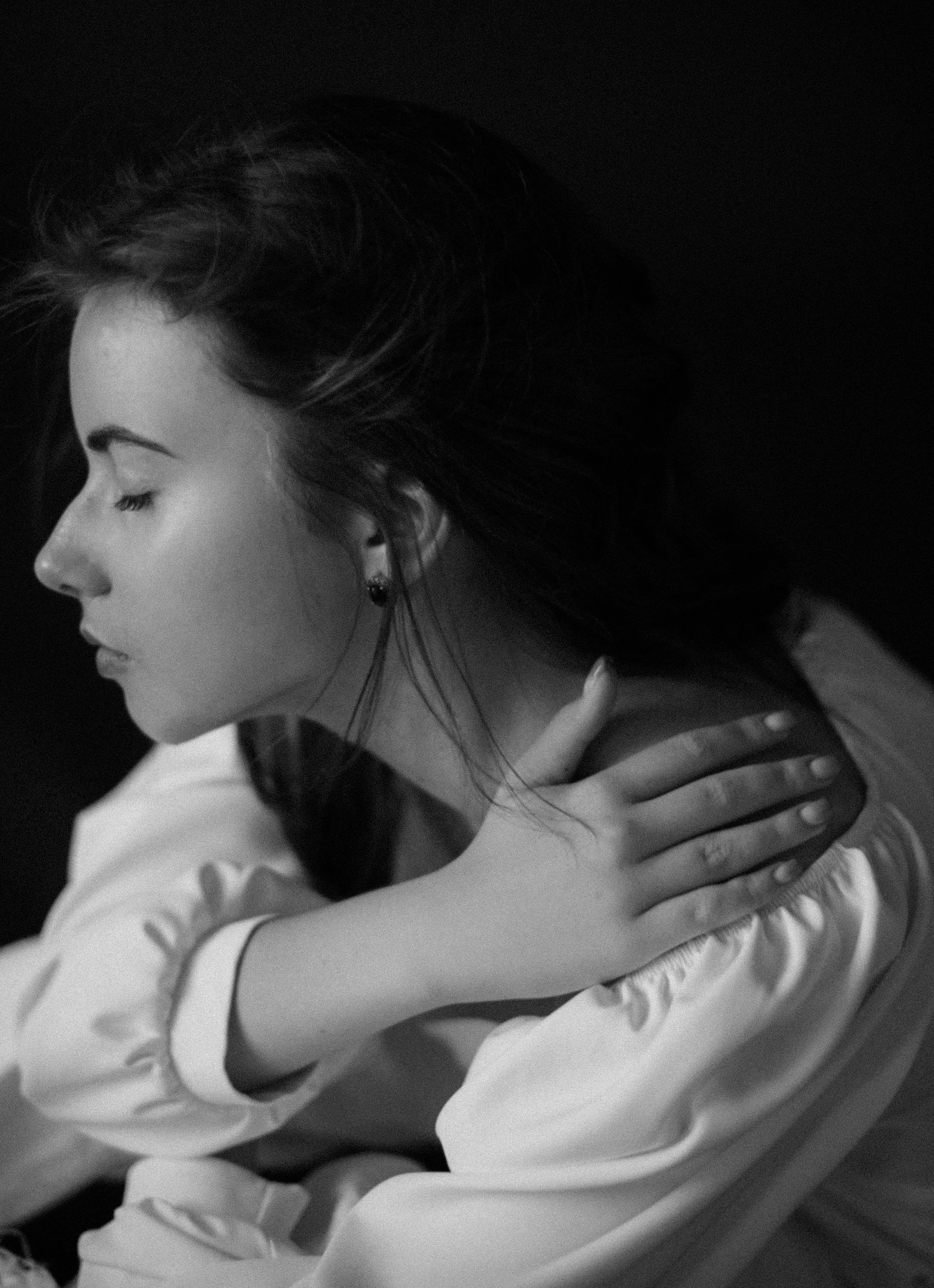 woman under stress holding neck | Stress and anxiety increasing physical tension and chronic pain