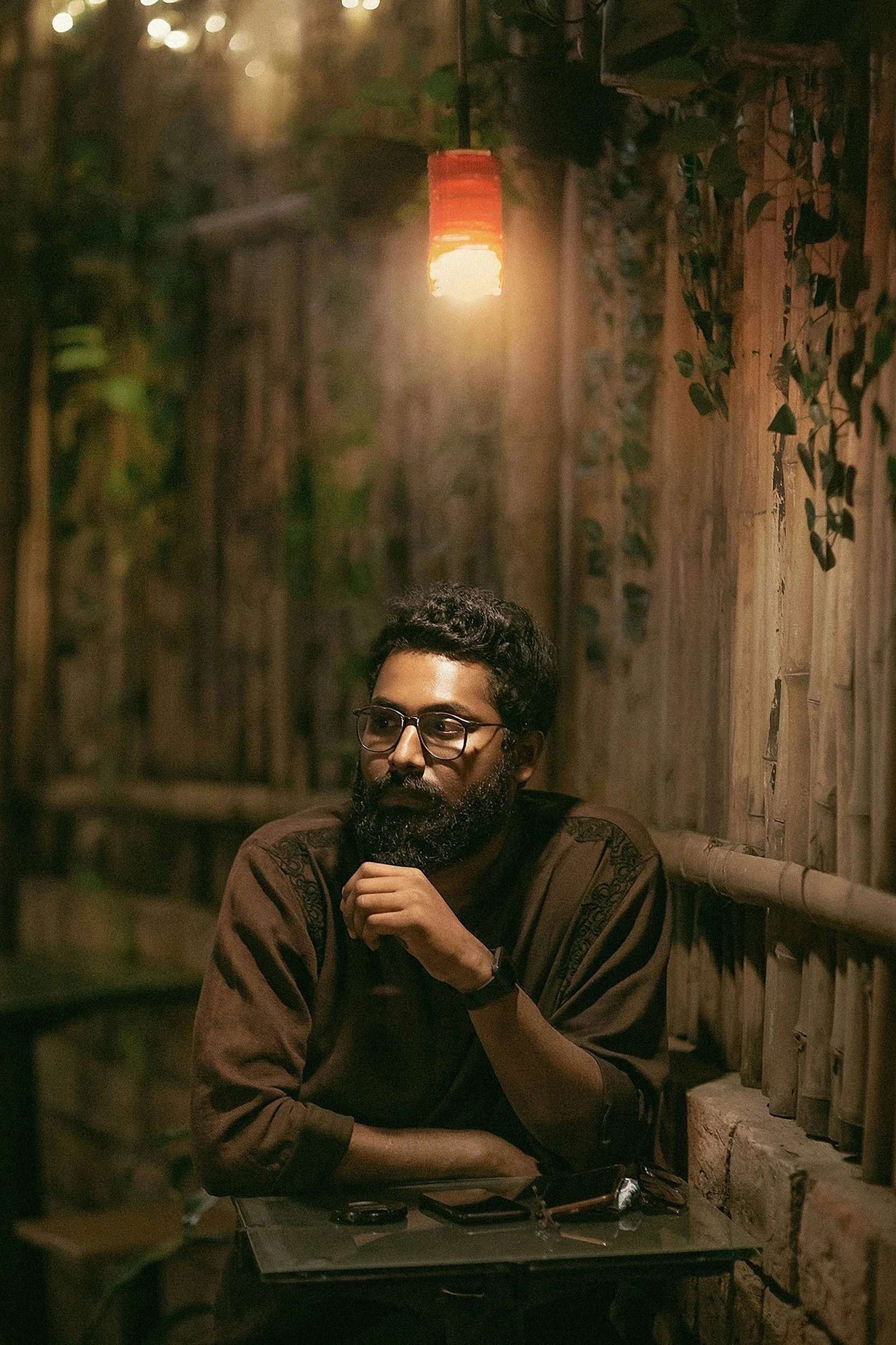 man sitting at table looking pensive | Noticing how stress and anxiety affect the body