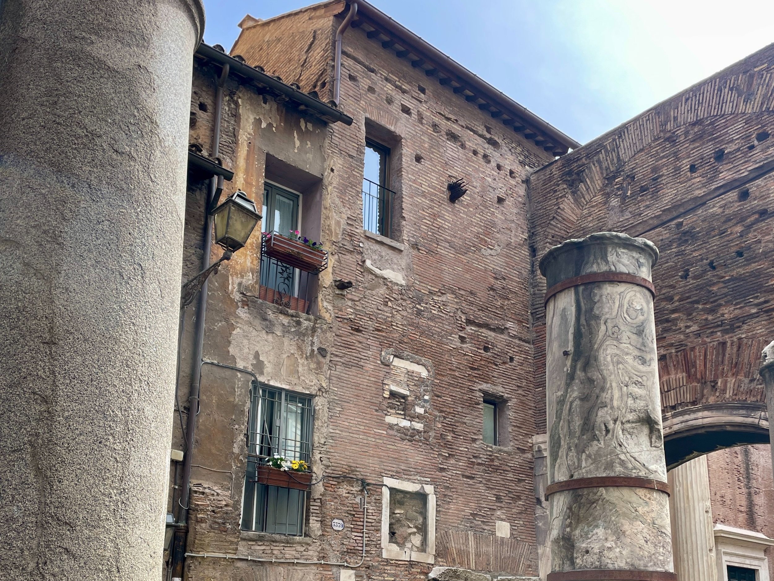 Medieval housing, flanked by Ancient columns. Photographed by Erin Hobbs