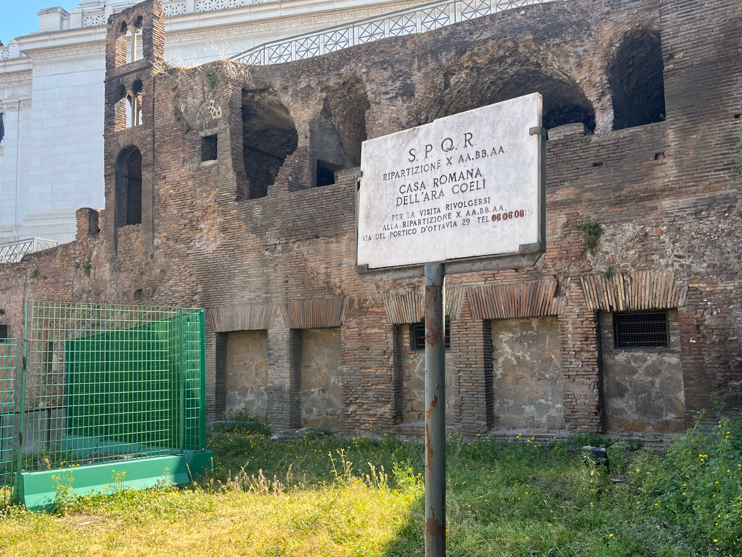Plaque detailing the Ancient and Medieval ruins excavated at the original location of Santa Rita da Cascia. Photographed by Lucy Martin.