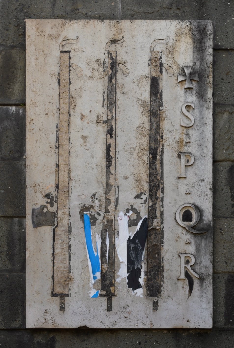 SPQR and remnants of fasces on a fountain. Photographed by Reid Graham.