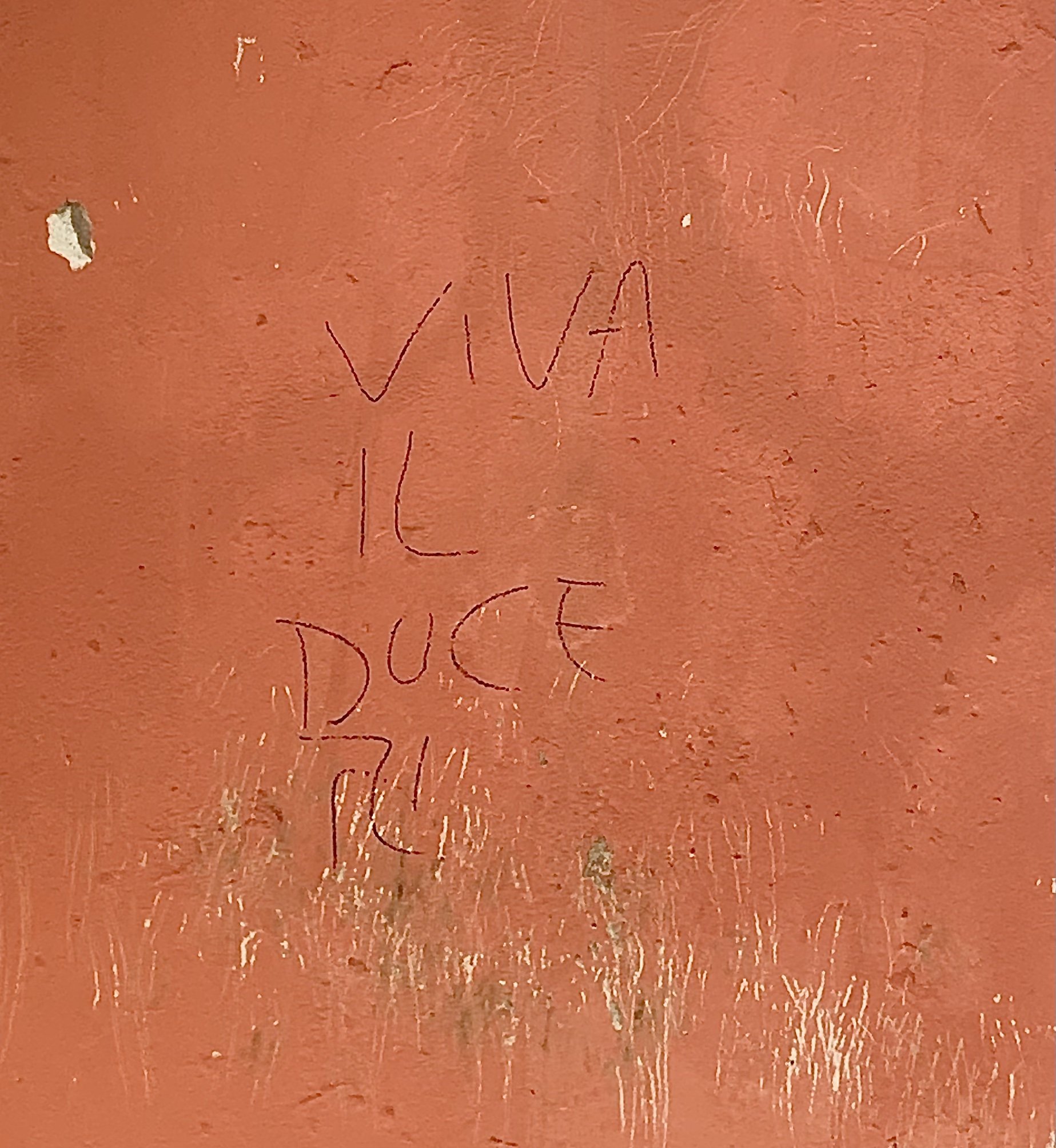 Modern graffiti supporting Mussolini, stating "viva il duce" or "long live the leader". Photographed by Reid Graham.