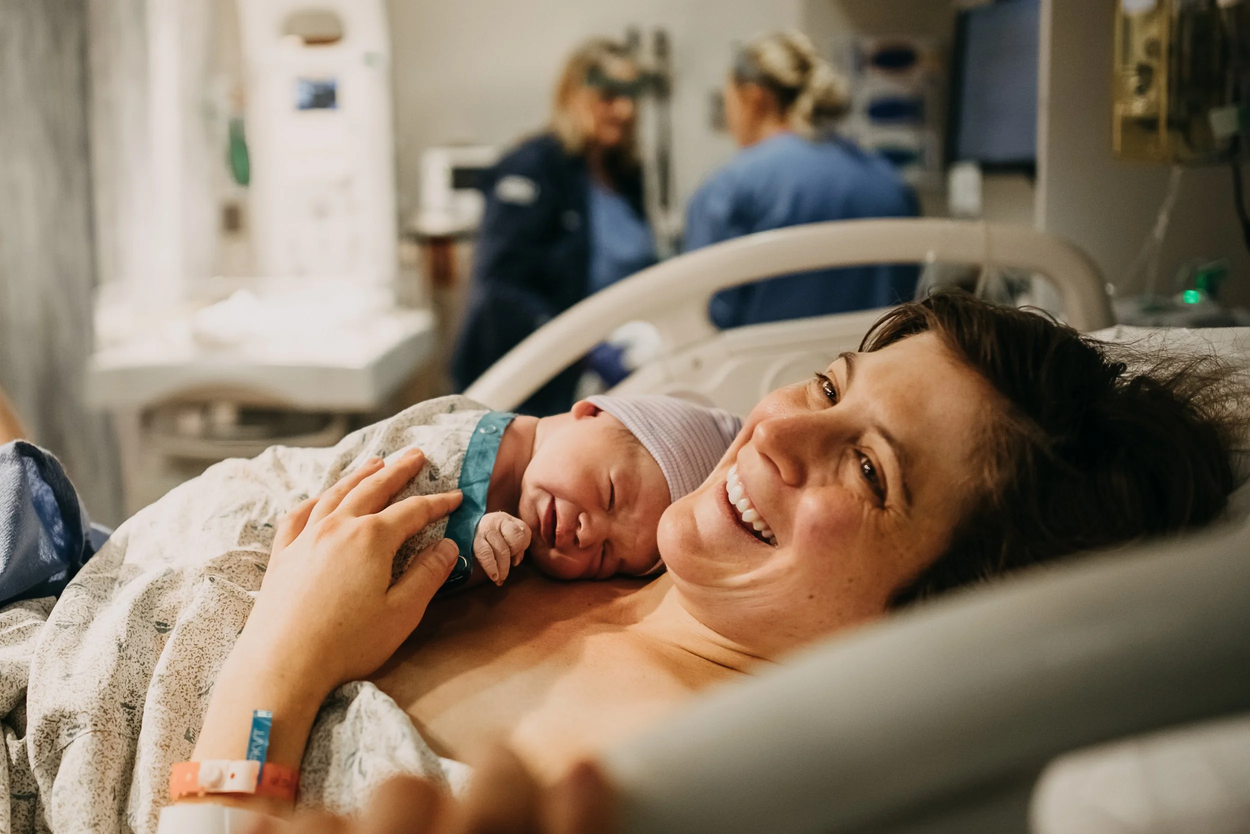mother holding newborn baby