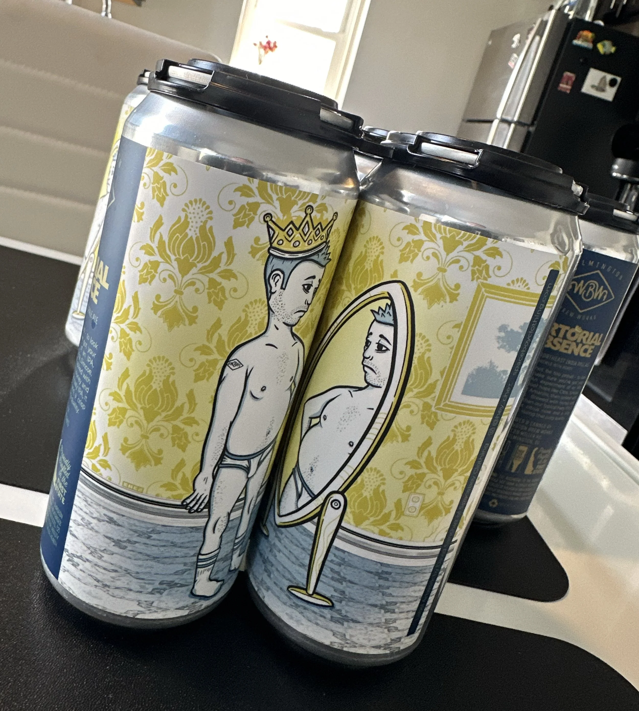Four-pack of beer cans with an artistic label featuring a man in underwear and a crown, standing in front of a mirror, reflecting a heavier version of himself.