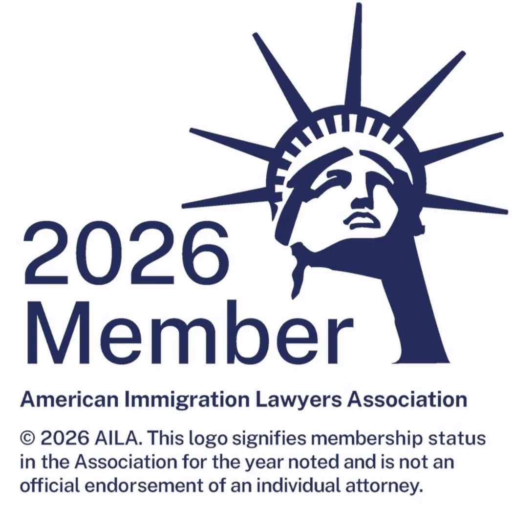 Logo of the American Immigration Lawyers Association featuring a stylized depiction of the Statue of Liberty's face with a crown of spikes, beside the text '2026 Member' and a disclaimer about membership status.