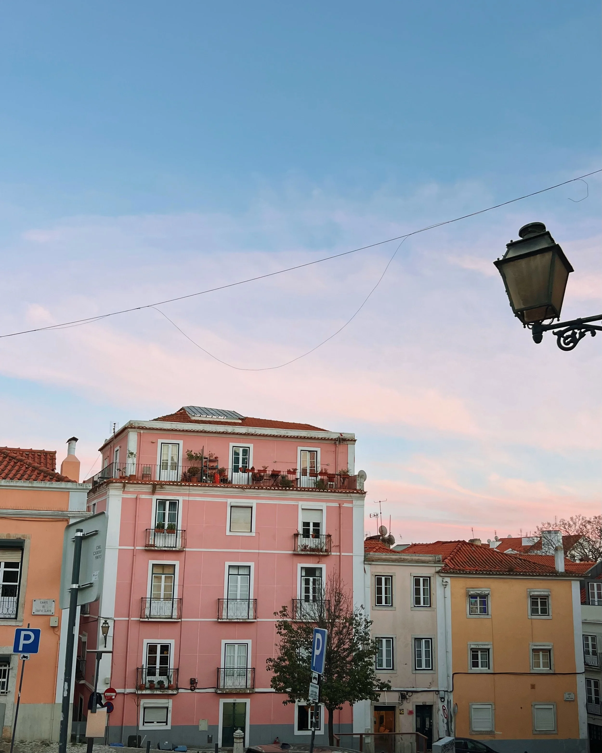 @rachel.finsthwait and i exploring lisbon! a very colourful city, even prettier with painted skies and vibrant eats 🍋 🌊 🍅