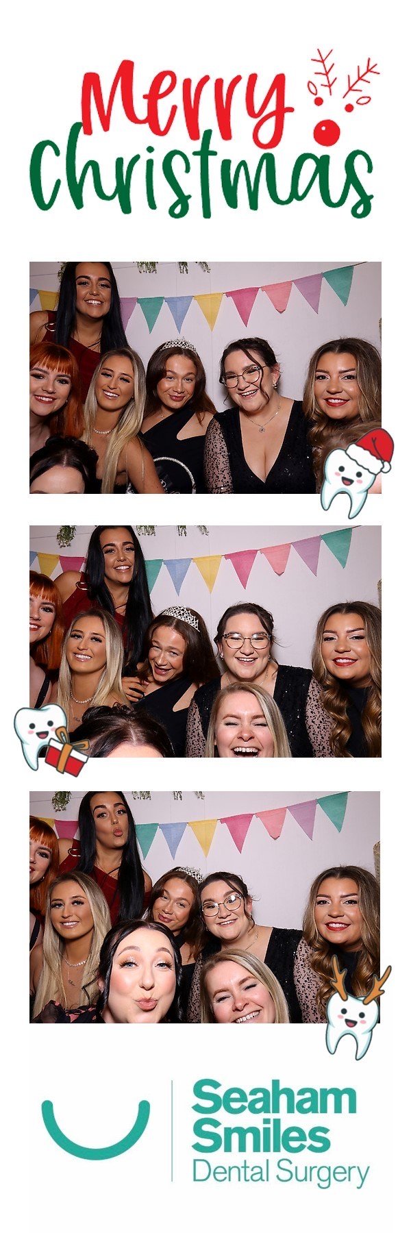 Group of women posing in a photo booth with Christmas-themed decorations and "Merry Christmas" text, associated with Seaham Smiles Dental Surgery.
