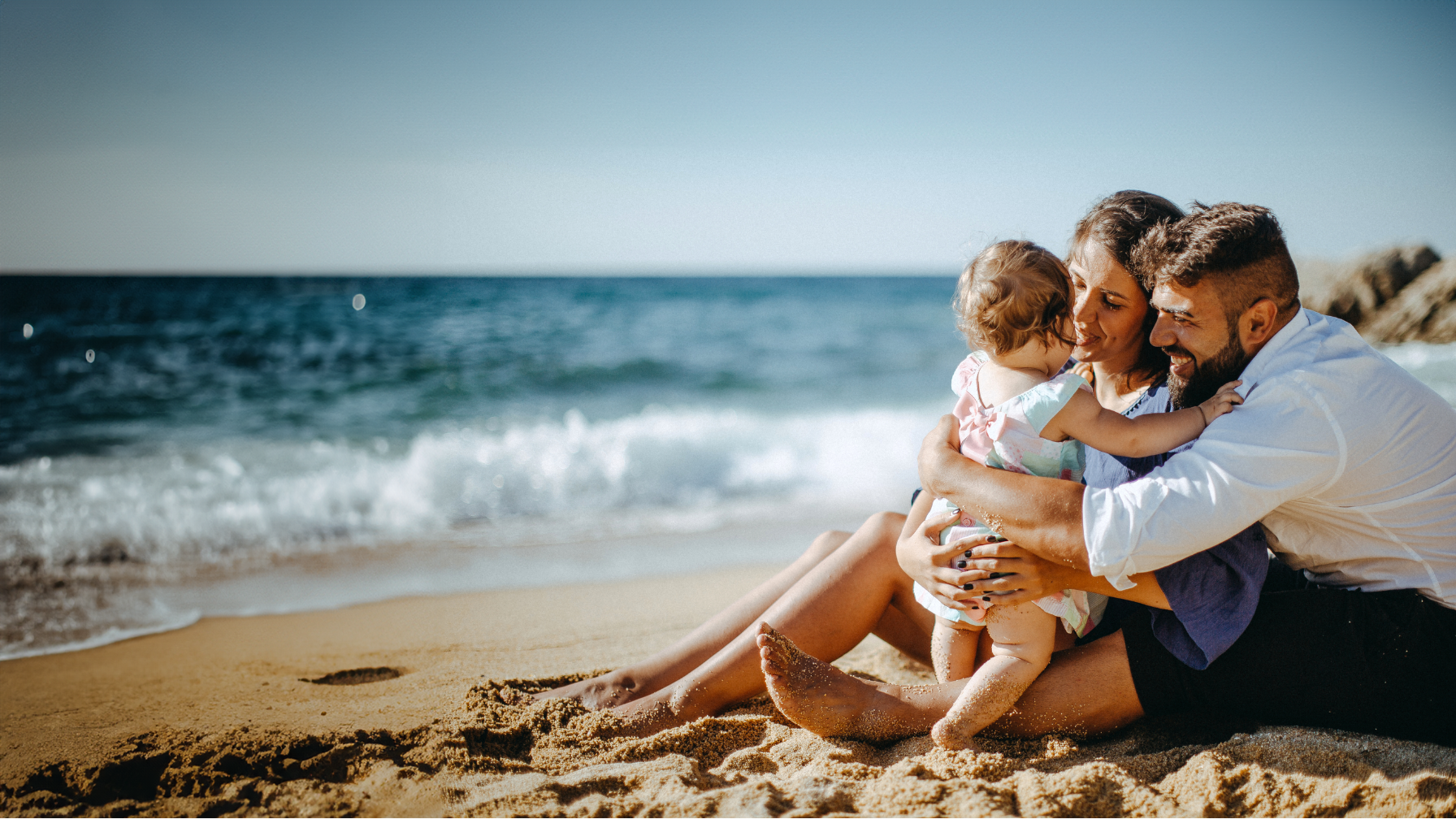 Family with baby on a California beach