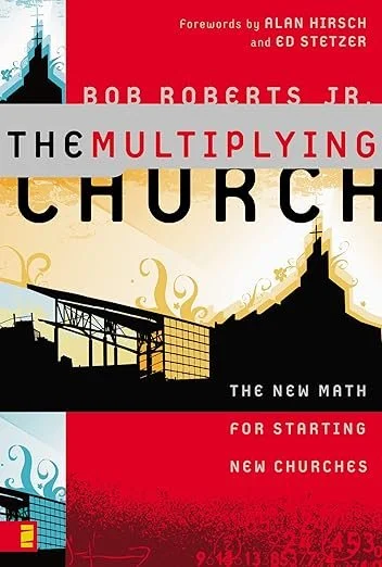 Book cover titled 'The Multiplying Church' by Bob Roberts Jr., with forewords by Alan Hirsch and Ed Stetzer. The cover features abstract church and cityscape illustrations in black, gold, and red.