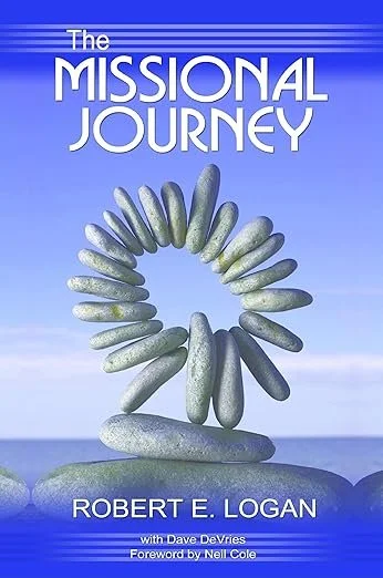 Book cover titled 'The Missional Journey' by Robert E. Logan with additional authors Dave DeVries and foreword by Neill Cole, featuring an image of rocks arranged in a circular pattern on a landscape