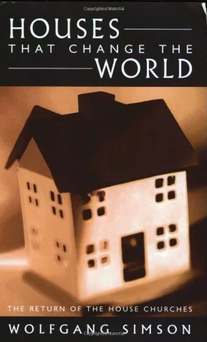 Book cover titled 'Houses that Change the World' by Wolfgang Simson, featuring a small model house with a dark roof and white walls with windows.