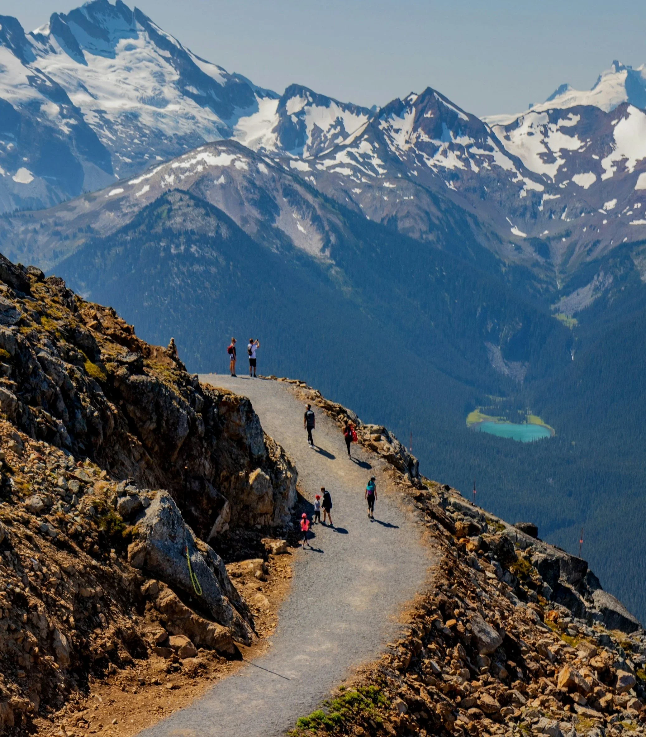 Group hiking in the mountains above Whistler, British Columbia during a group outdoor experience.