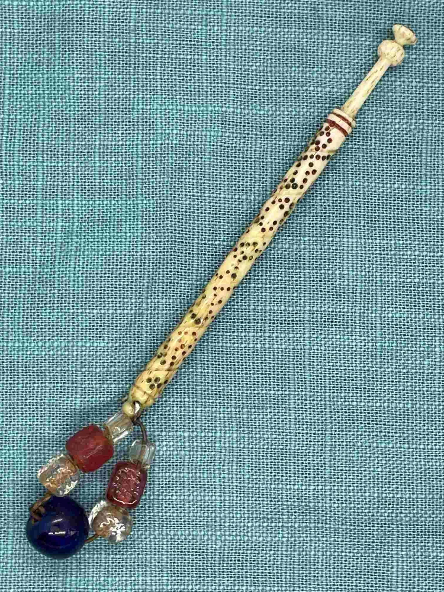 19th-century Antique Bone Bobbin with spiral inscription and spangle (our ref W11)