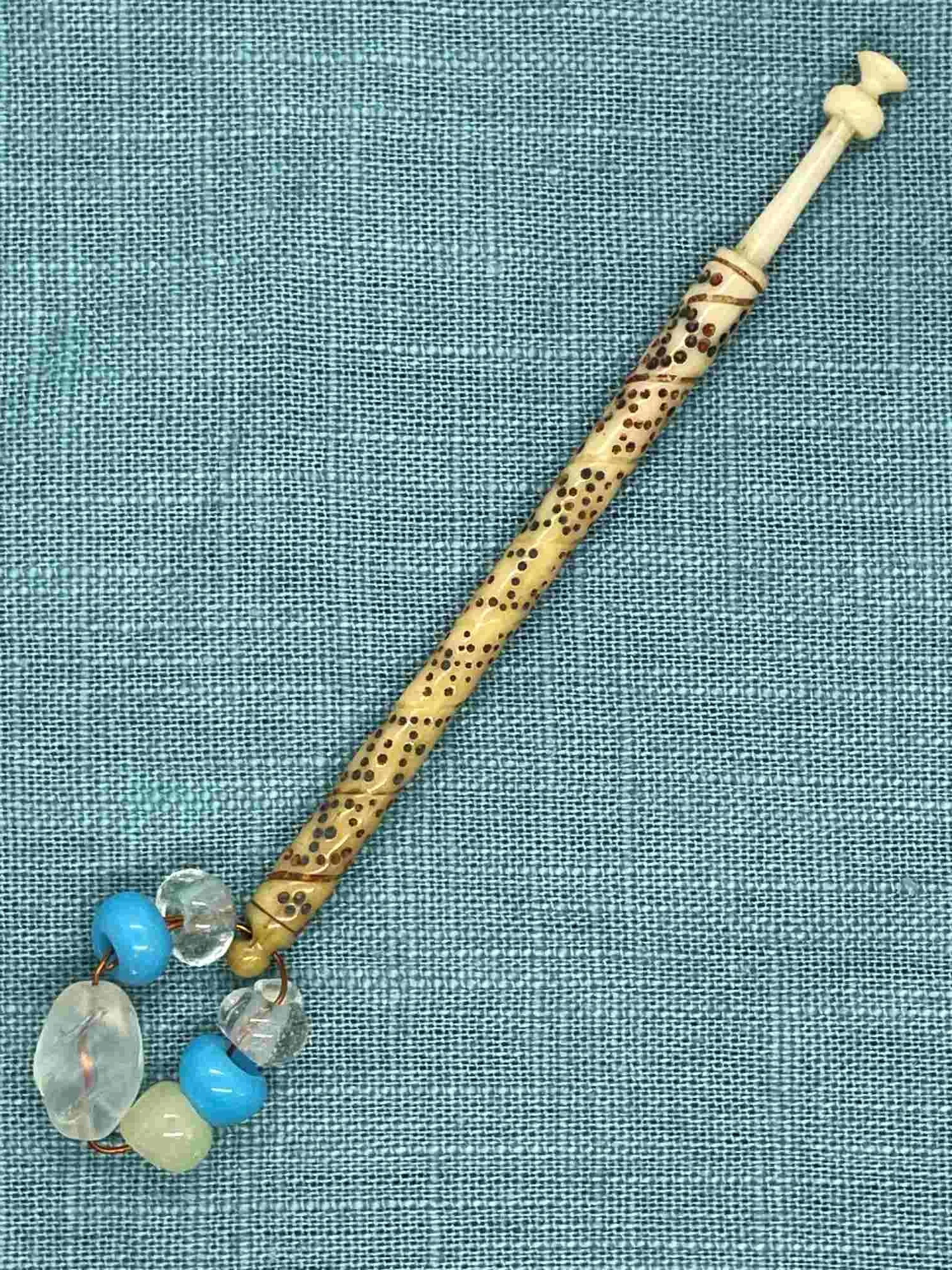 19th-century Antique Bone Bobbin with spiral inscription and spangle (our ref W9)