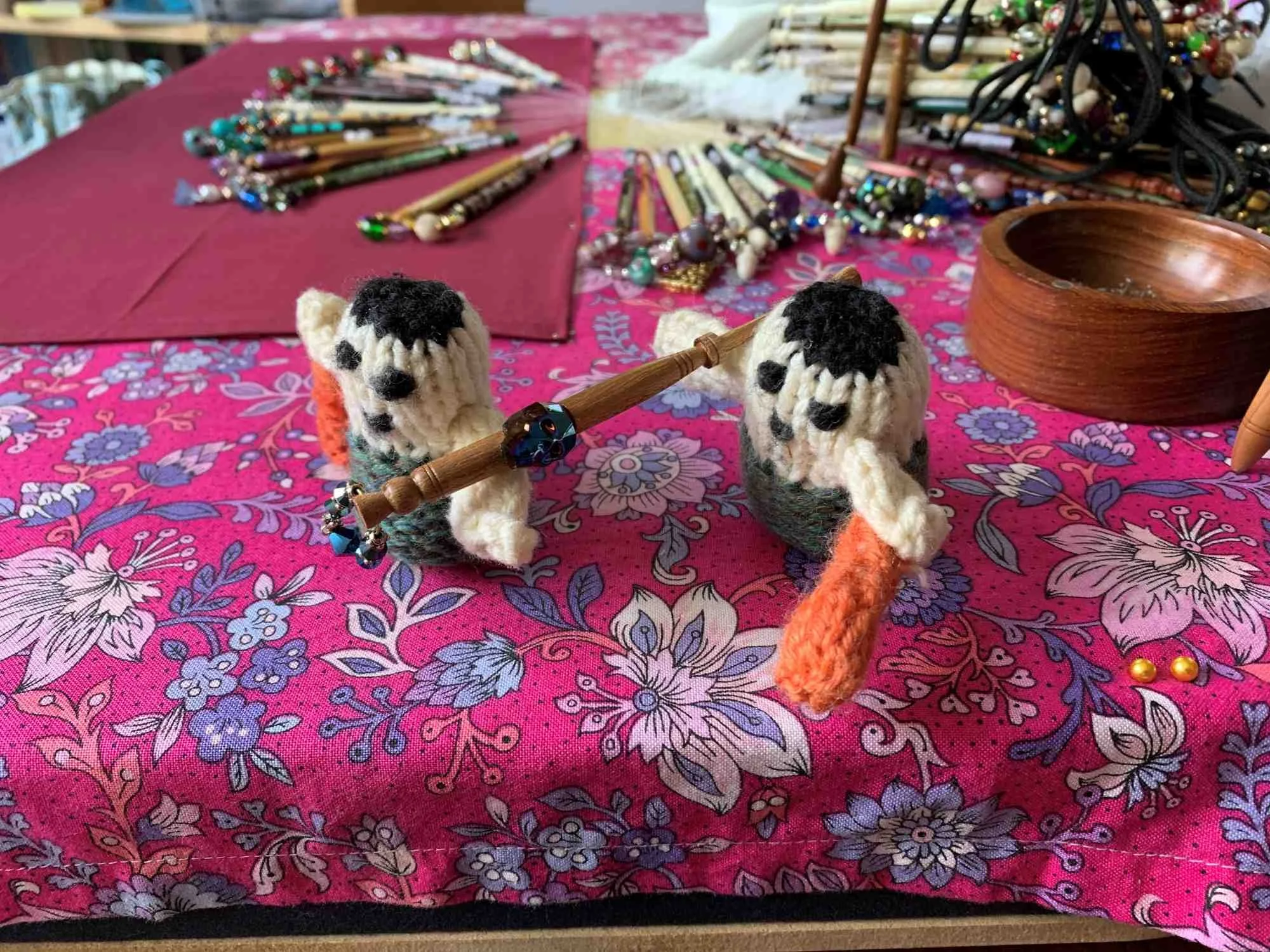 #peskyknittedcavemen carrying lace bobbin with skull bead insert