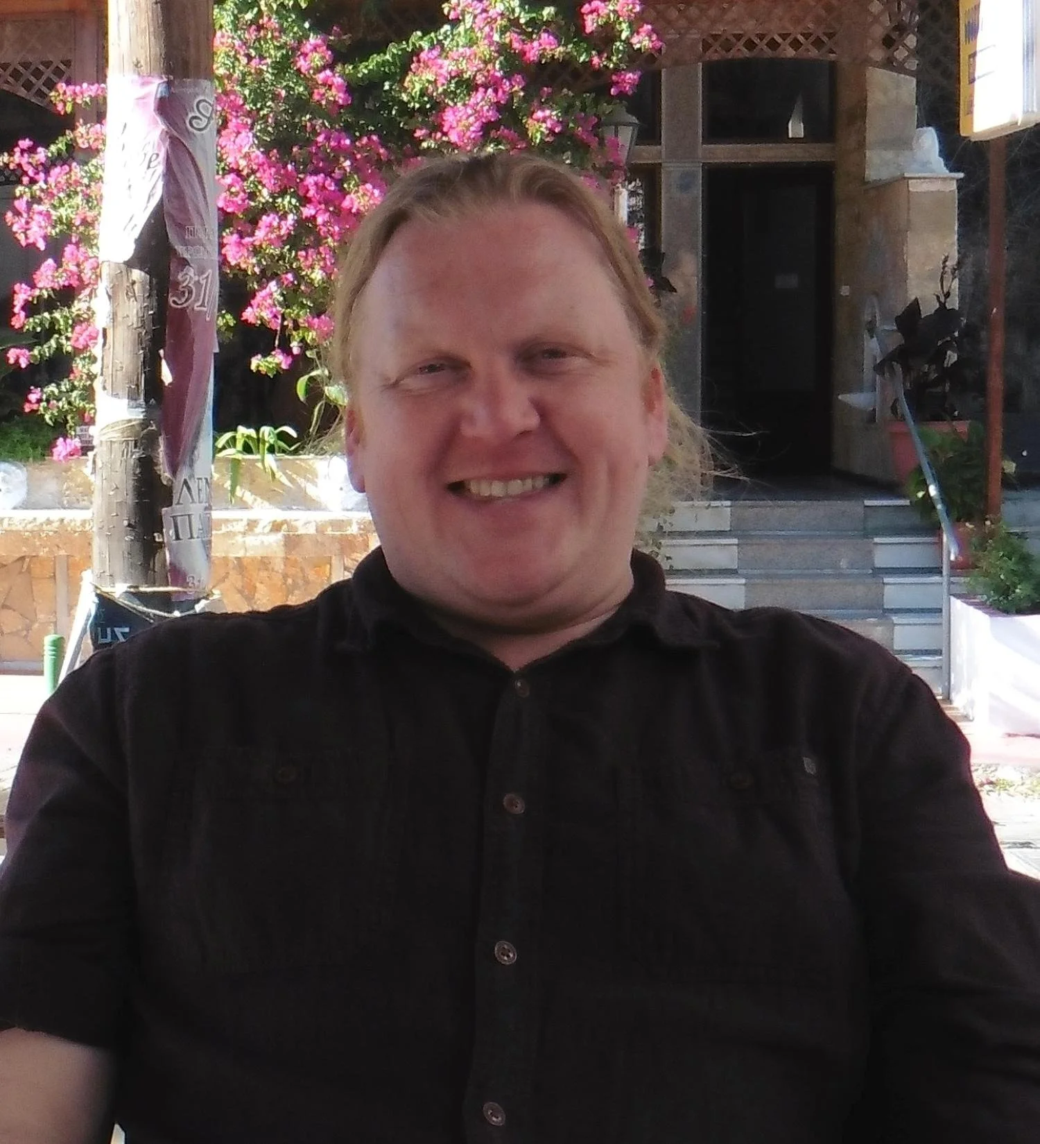 Eddy Faber smiling sat in cafe in Crete