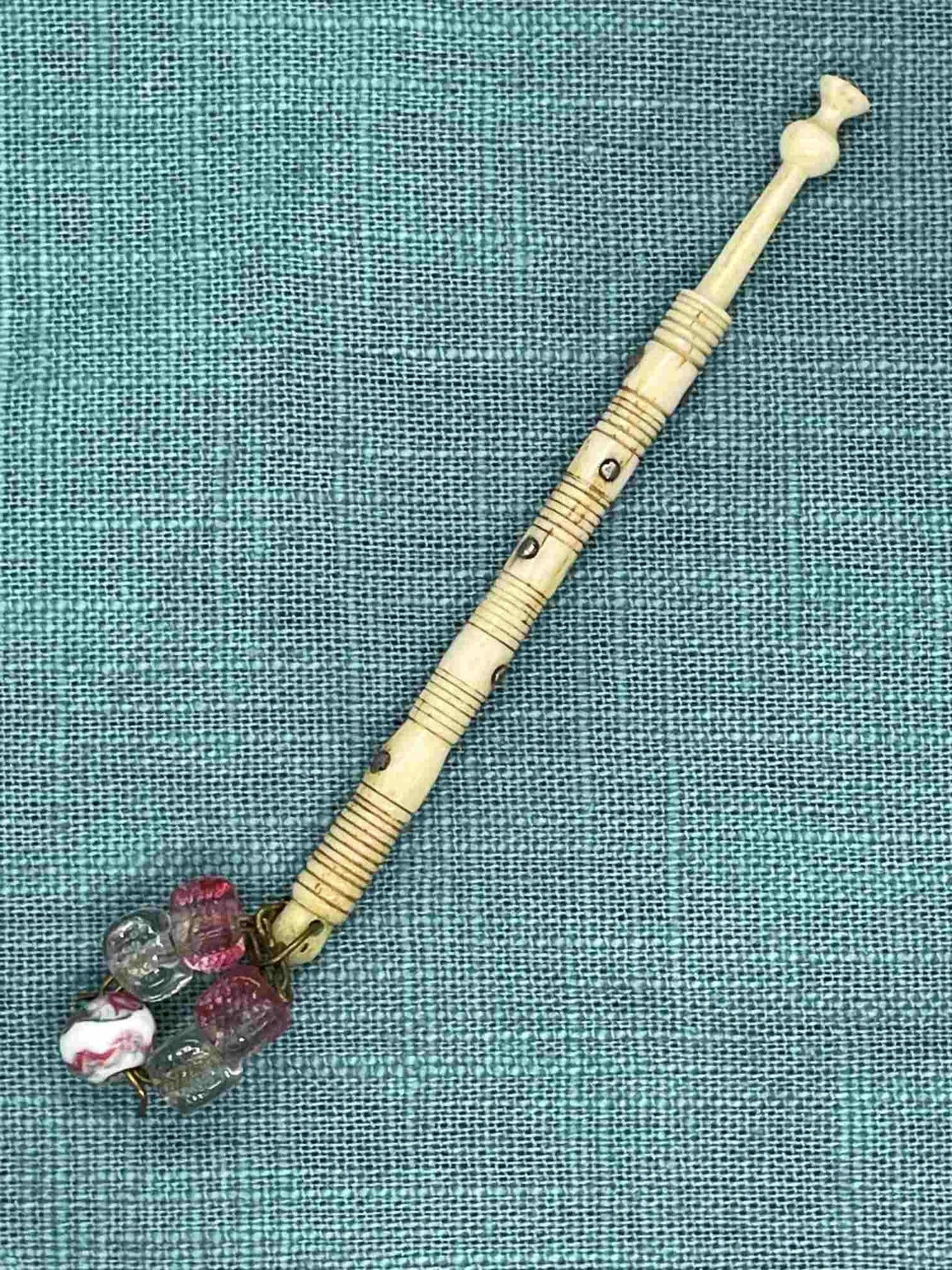 19th-century Antique Bone 'Leopard' Bobbin with spangle, nibbled head (our ref W4)