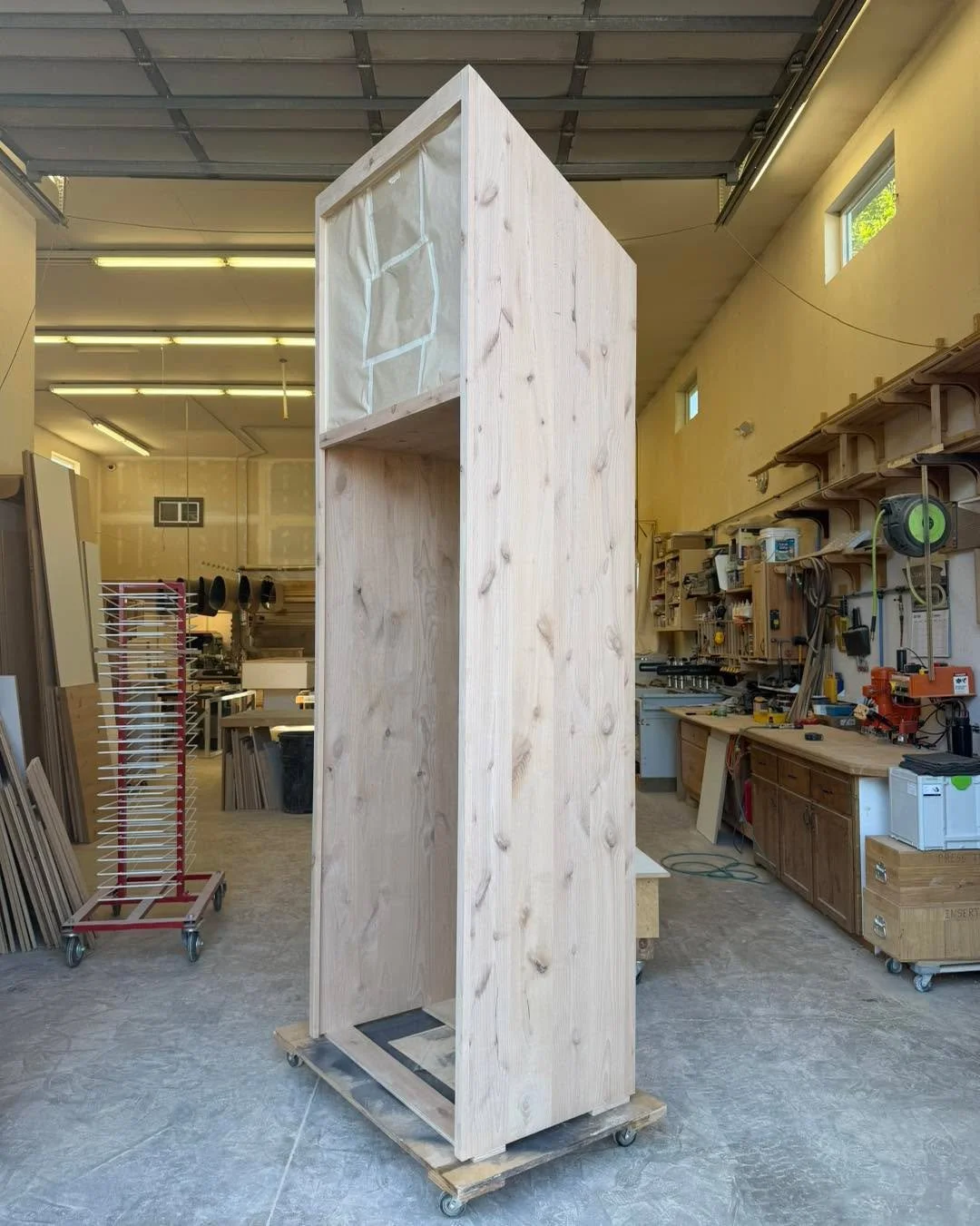 This custom 10-foot refrigerator cabinet was built to perfectly fit an angled ceiling, creating a seamless, built-in look without compromising on function. Every project is designed and handcrafted to fit your home&mdash;not the other way around.

At