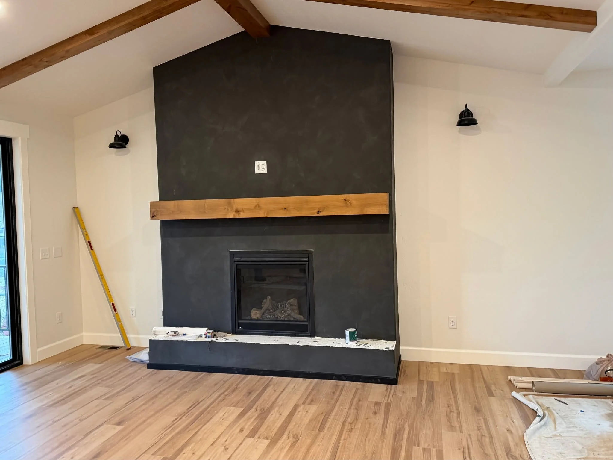 From raw craftsmanship to the finished focal point.

This custom mantel started in the shop and came to life as a warm, natural statement piece that completely transforms the fireplace. It is always exciting seeing a project go from stain booth to fi