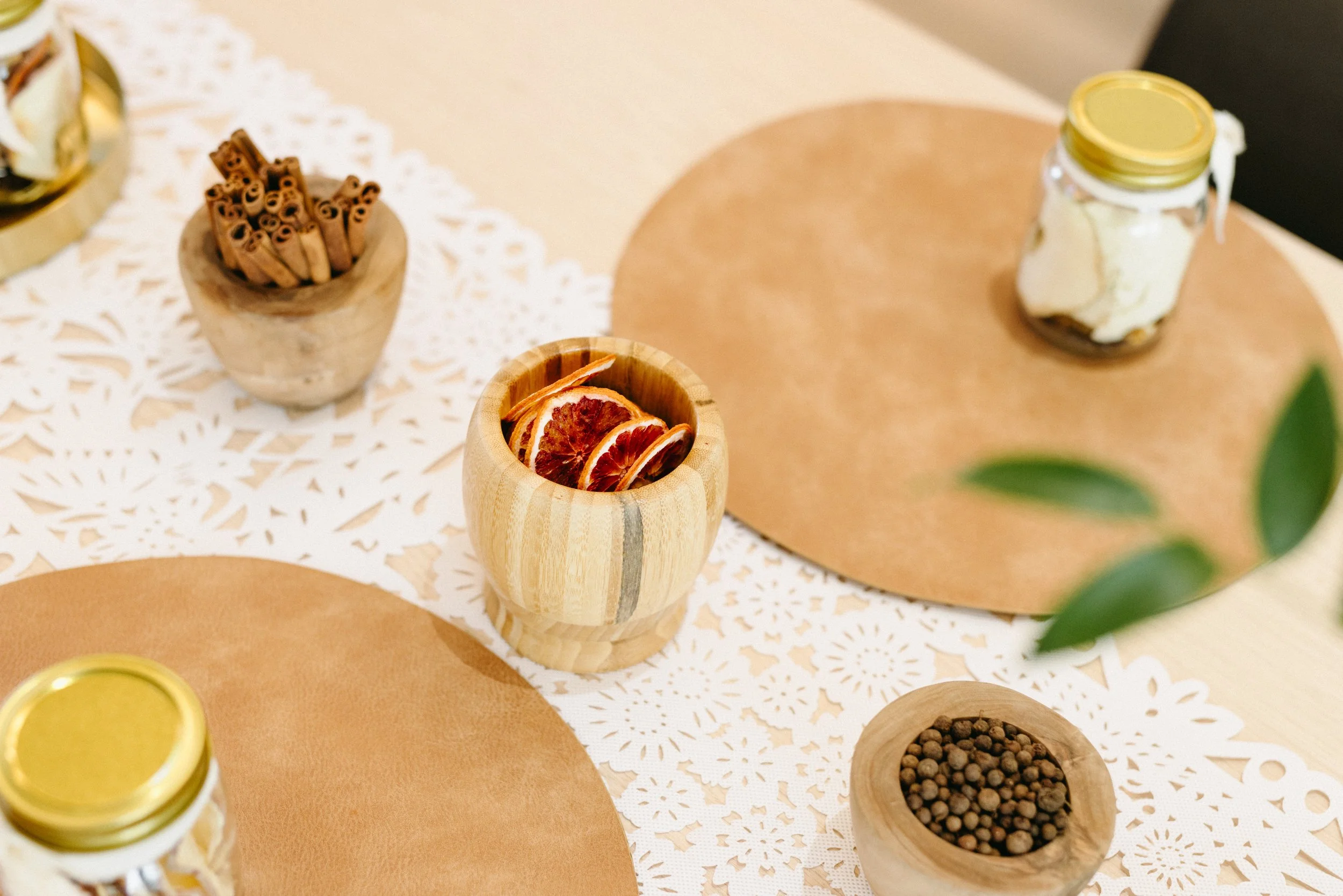 For the Cocktail Infusion, a variety of dehydrated fruit and other cocktail botanicals set on a table for a multi person workshop.