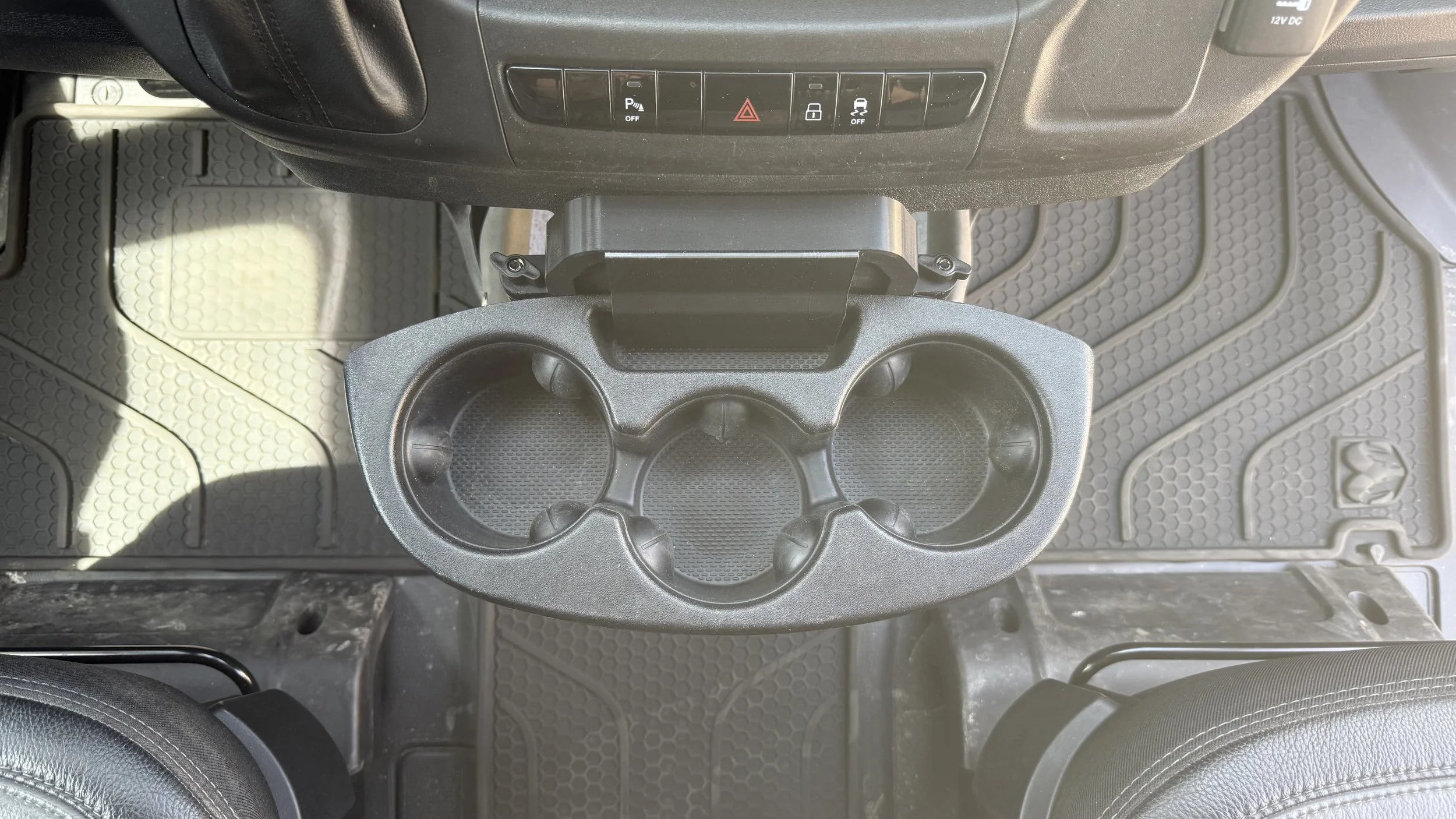 Top down view of 2022+ Ram Promaster Cupholder relocated to a position higher up on the lower instrument pane.  The cupholder was relocated using 3D Printed 2022+ Ram Promaster Cupholder Relocation Kit
