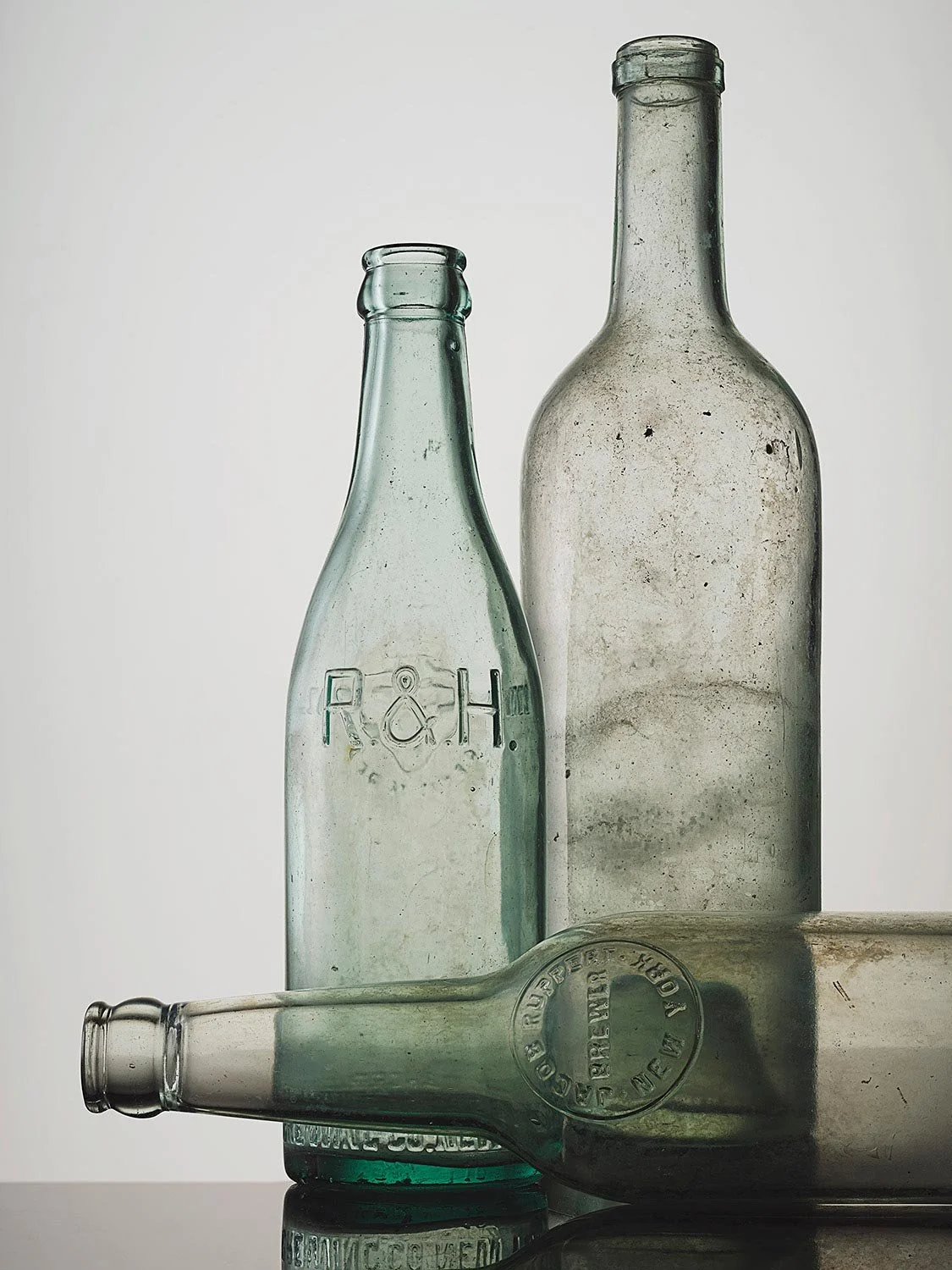 antique-bottles-classic-still-life-clean-studio-photography.jpg