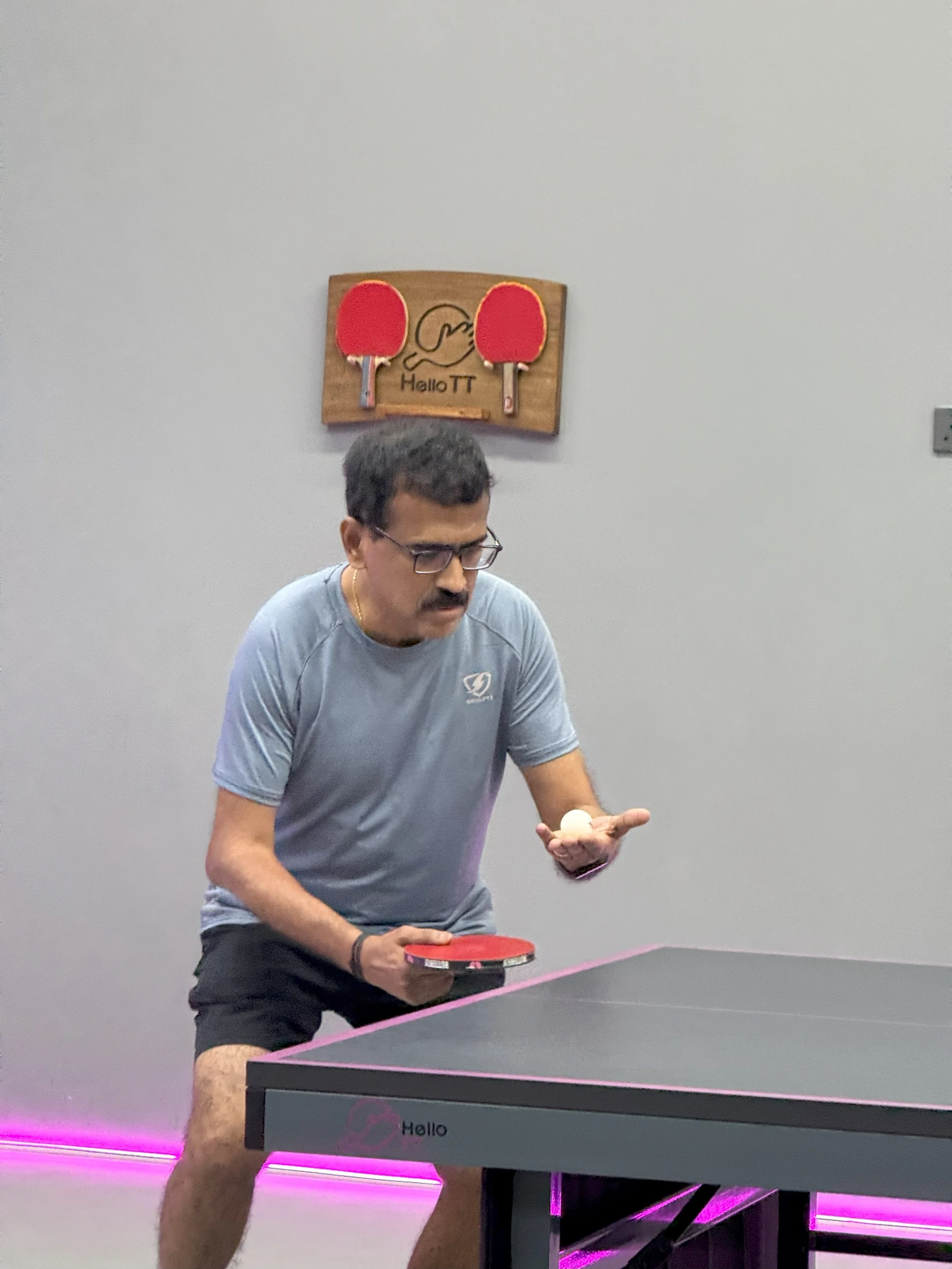 Adult players practicing rally drills at HelloTT