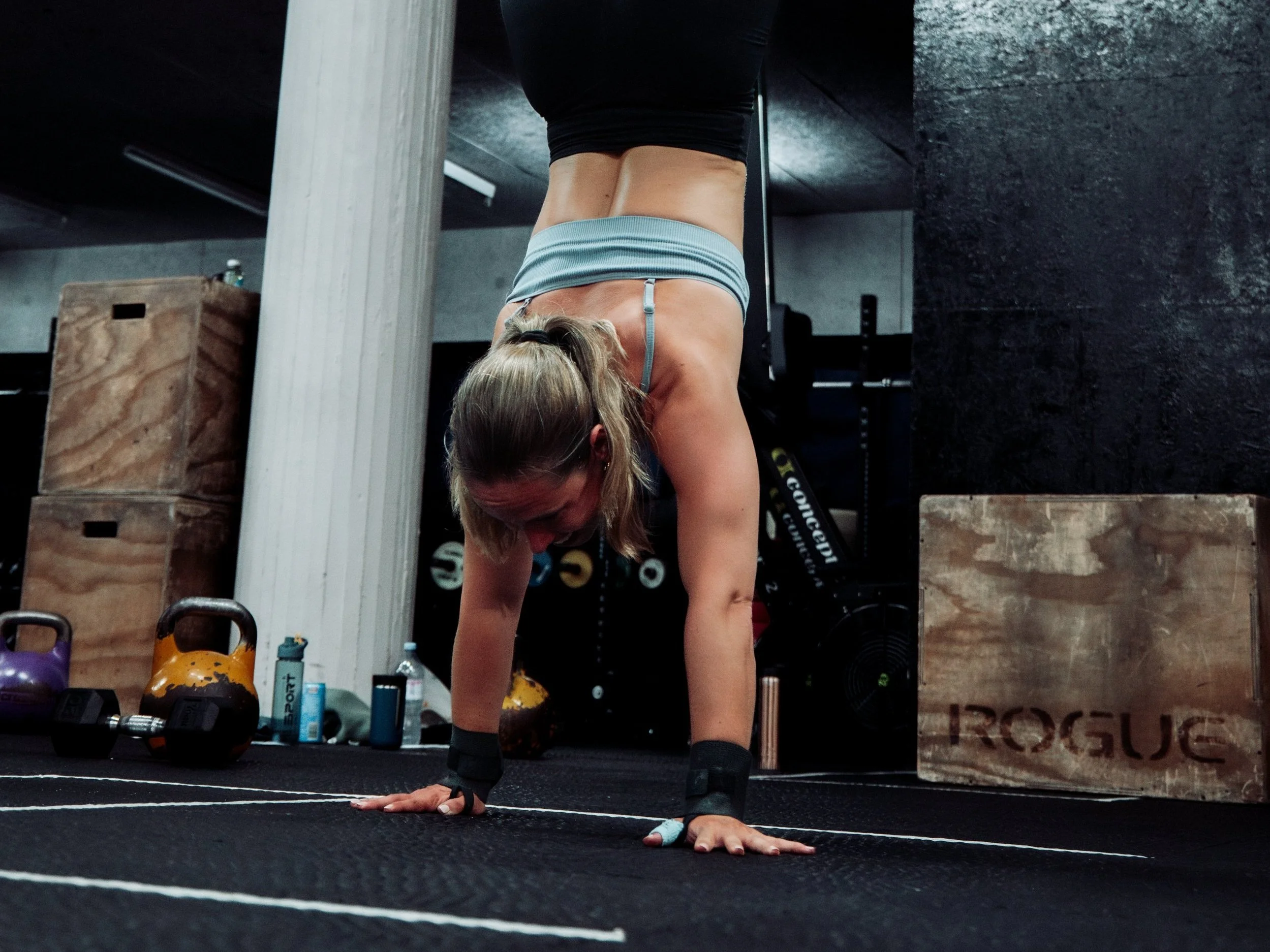 athlete practicing a handstand walk