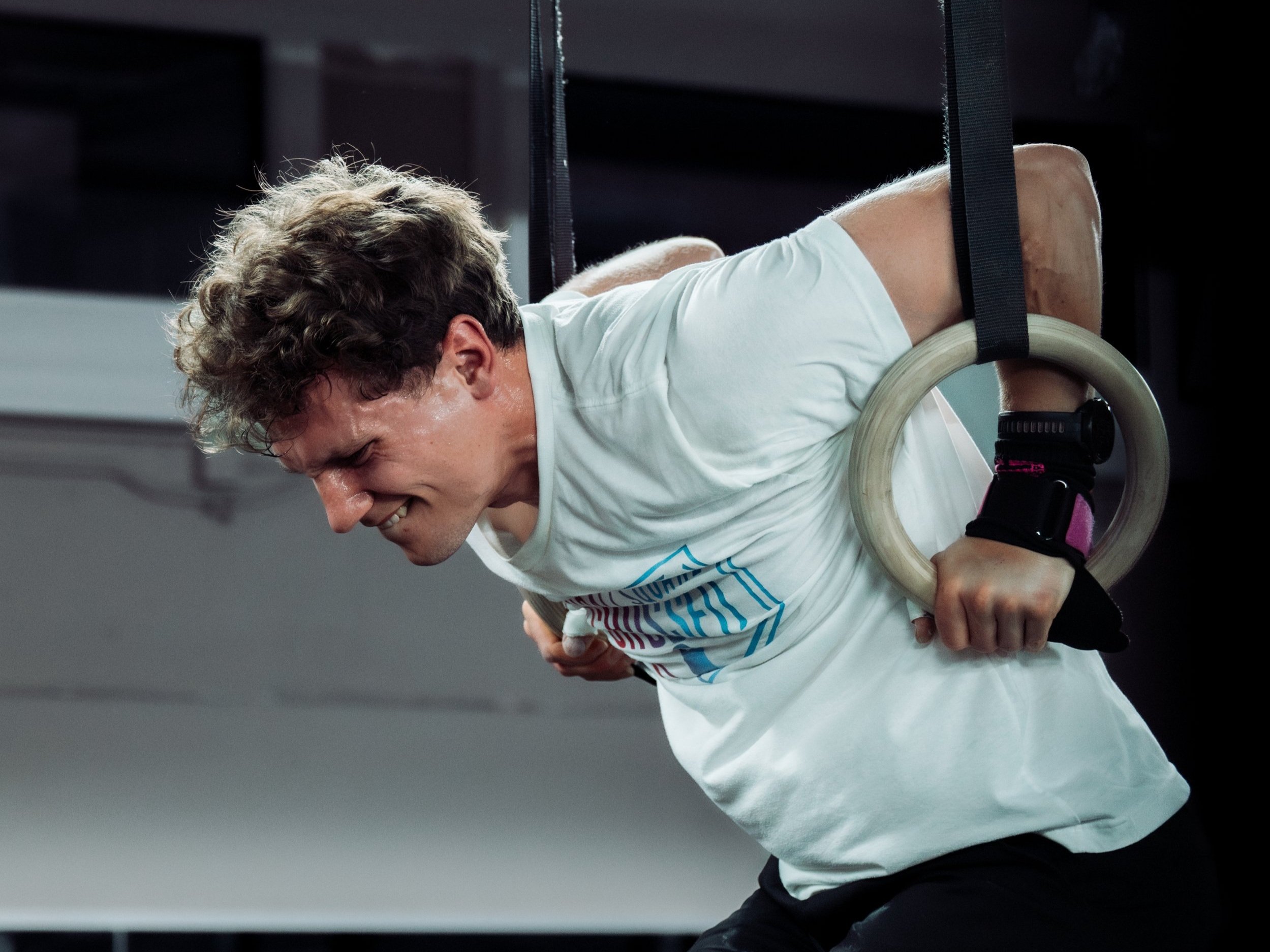 athlete performing a ring muscle up