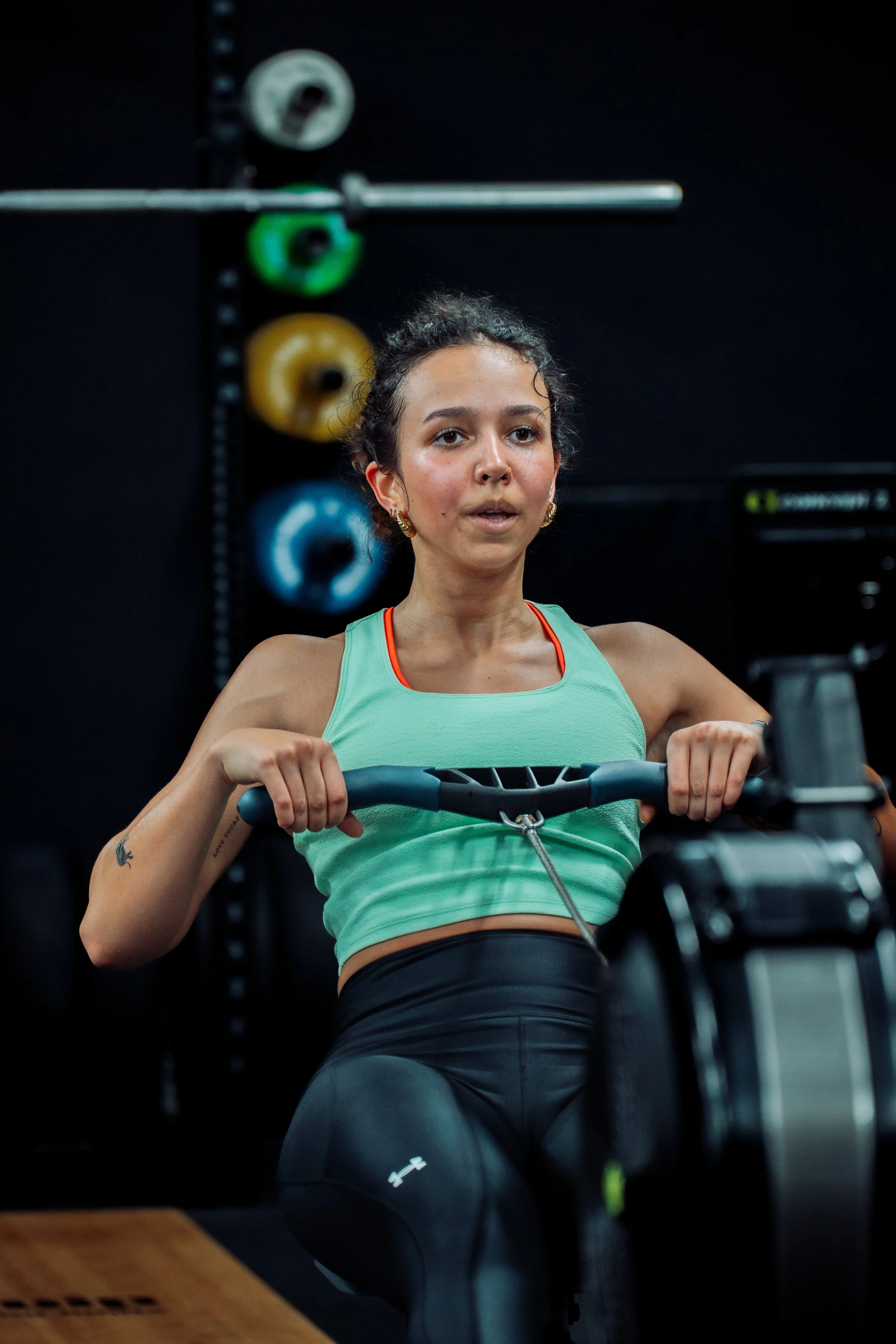 A women on a concept2 rower
