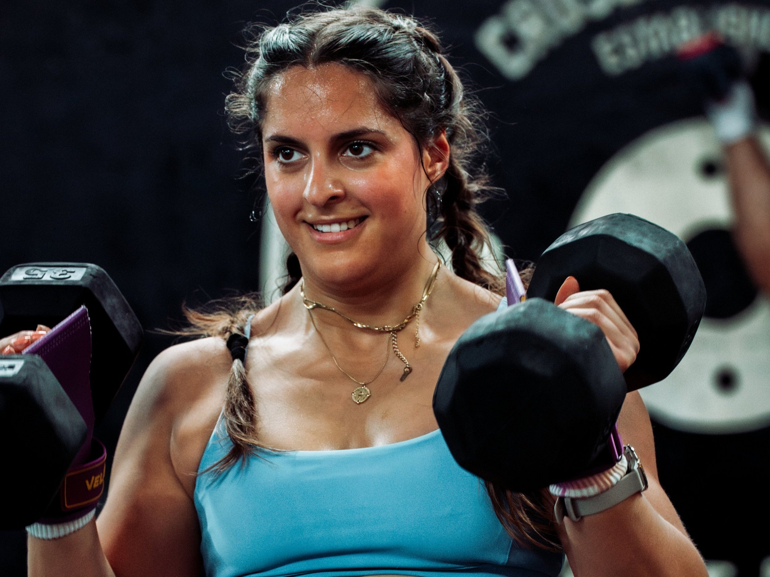 Athlete performs a dumbbell clean & jerk