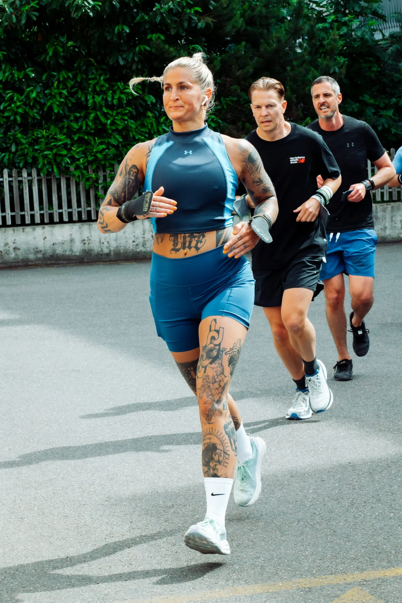 three athletes running
