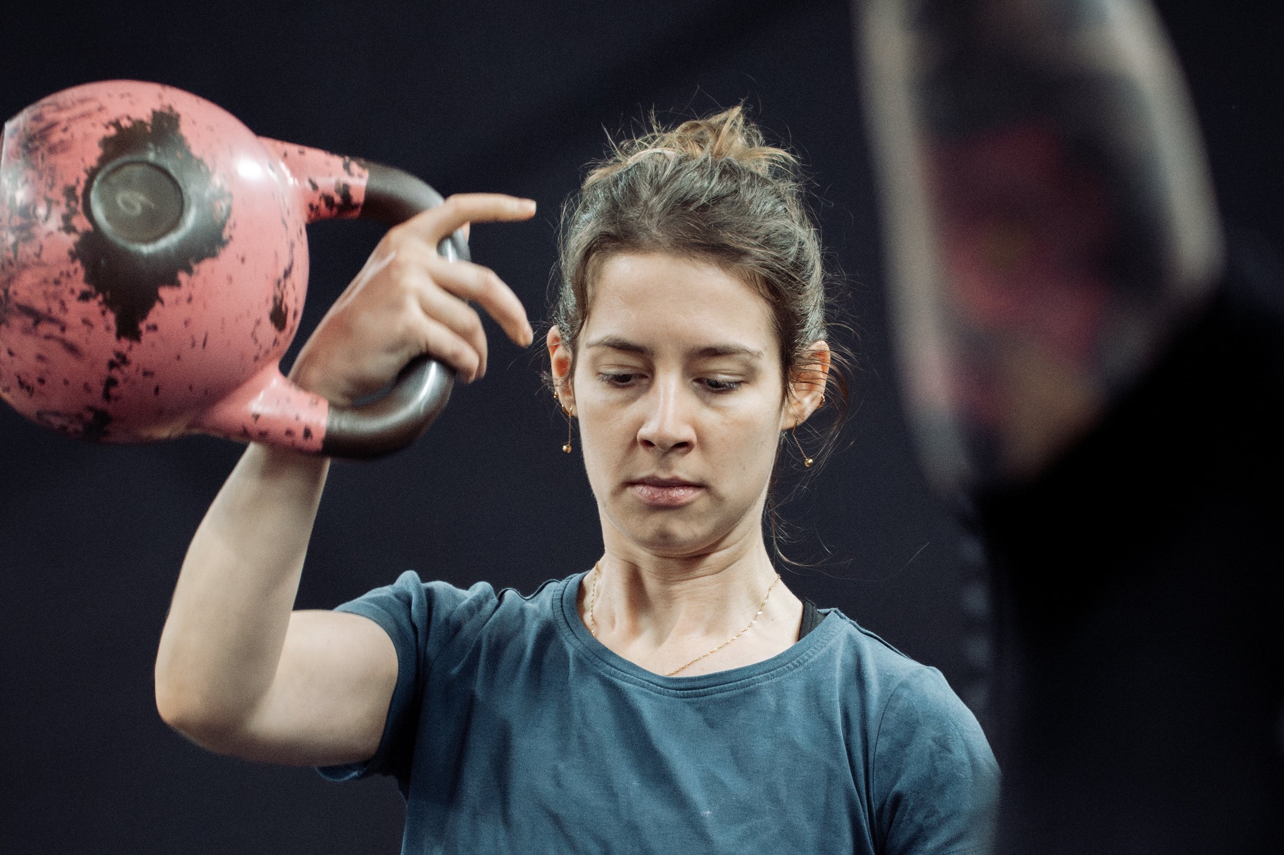 athlete performing a single arm kettlebell snatch