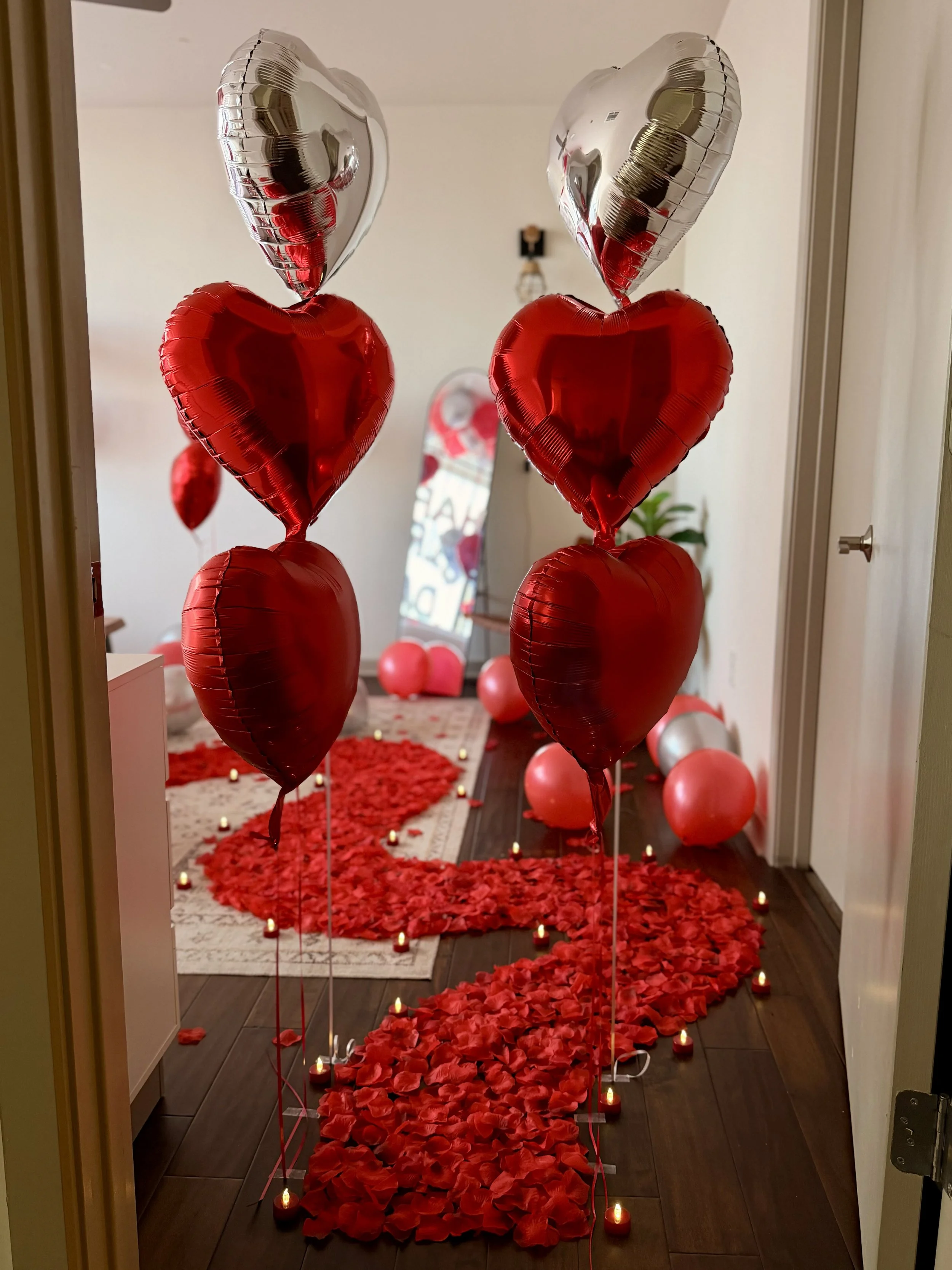 A luxurious curved rose petal path beautifully arranged through a romantic room, creating an elegant and unforgettable atmosphere for a special occasion in Dallas-Fort Worth.