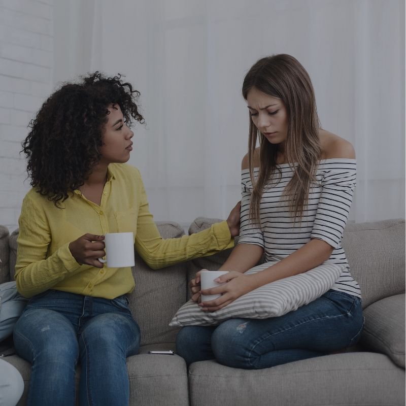 friends consoling each other about relationship problems