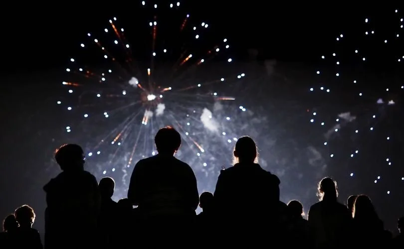people watching new year fireworks